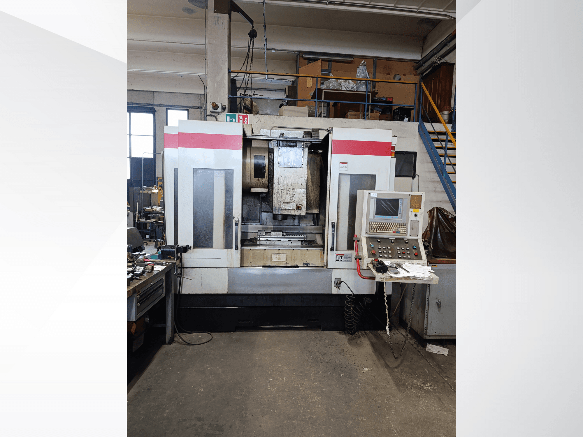 CNC machine with control panel and operational interface, front view. Brand and model not visible; details include operating buttons and display.