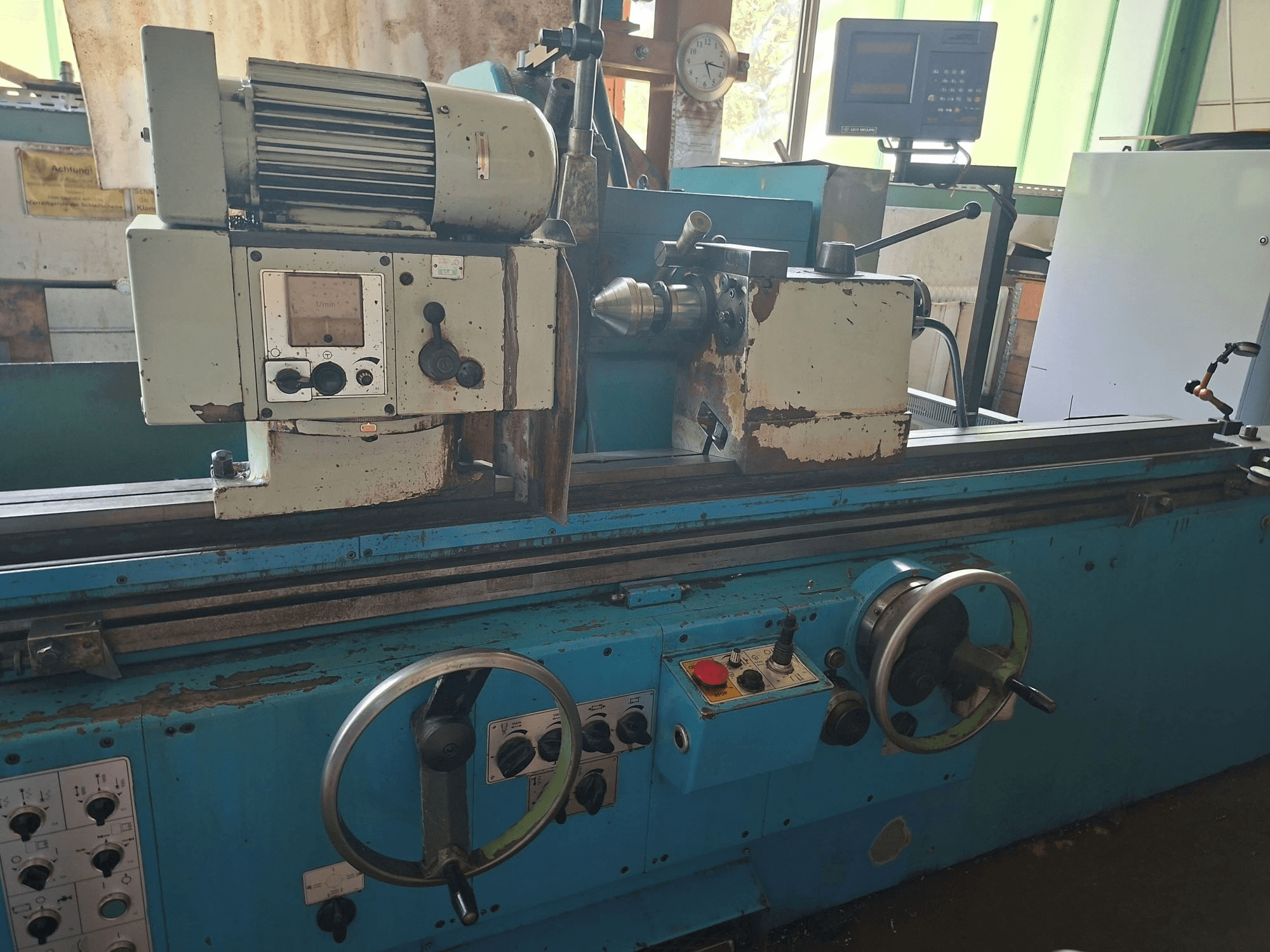 Cetos BHU 50 A x 2000 cylindrical grinding machine, front view, showing controls, motor, and work area in a workshop setting.