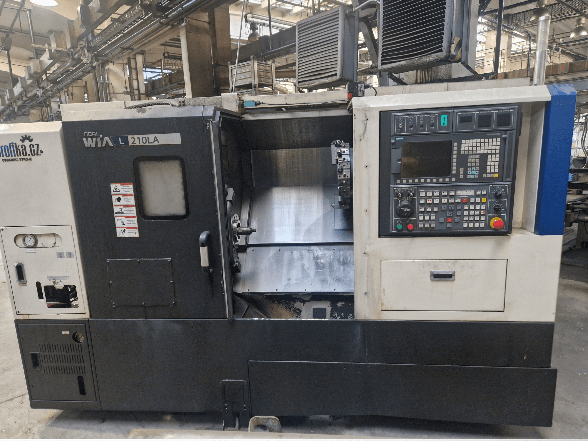 WIA L210LA CNC lathe machine, front view, features control panel with buttons, display, and a visible machining area.