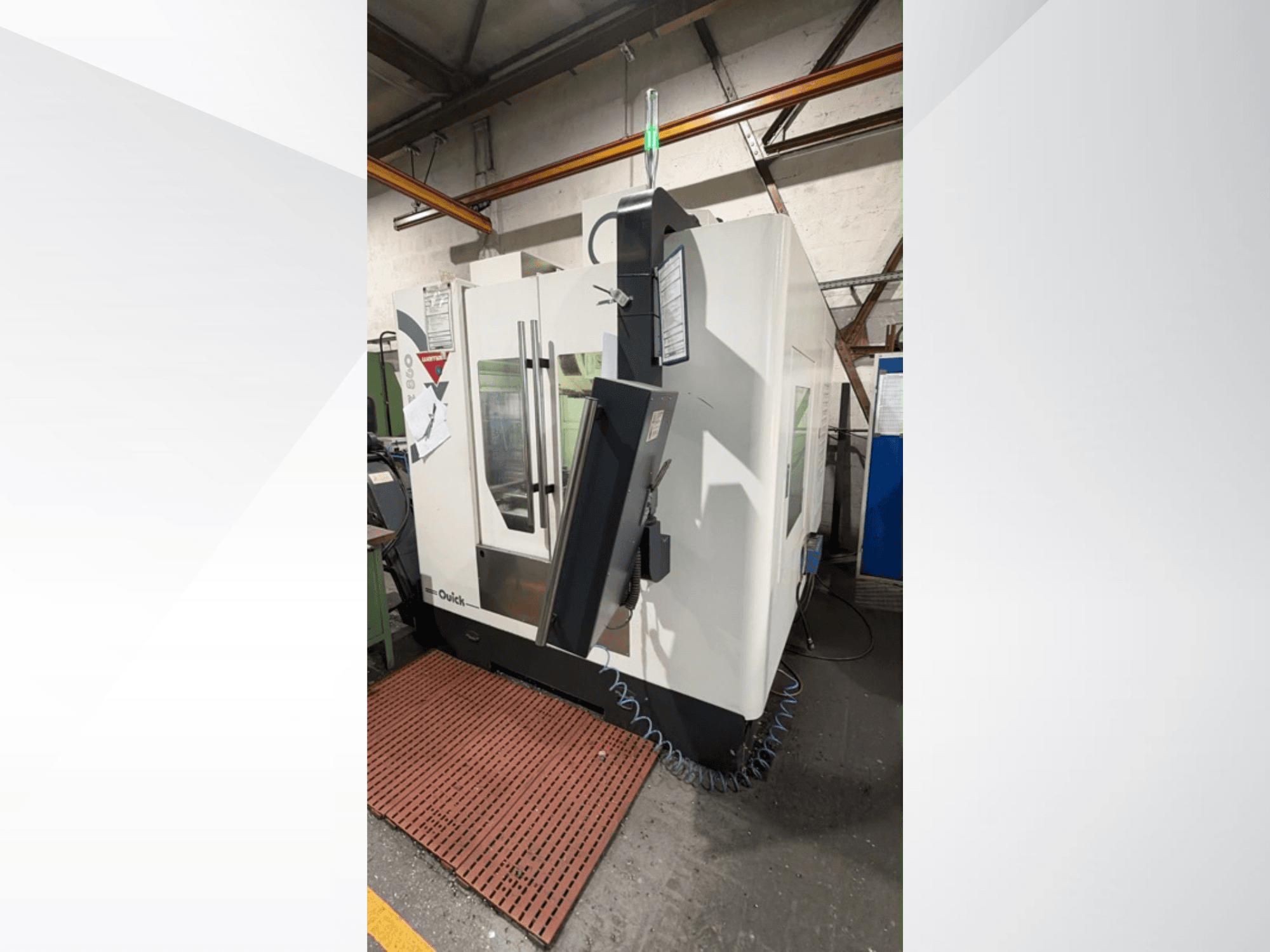 Alt text: WEMAS VZ 860 vertical machining centre, side view, featuring control panel and transparent doors.
