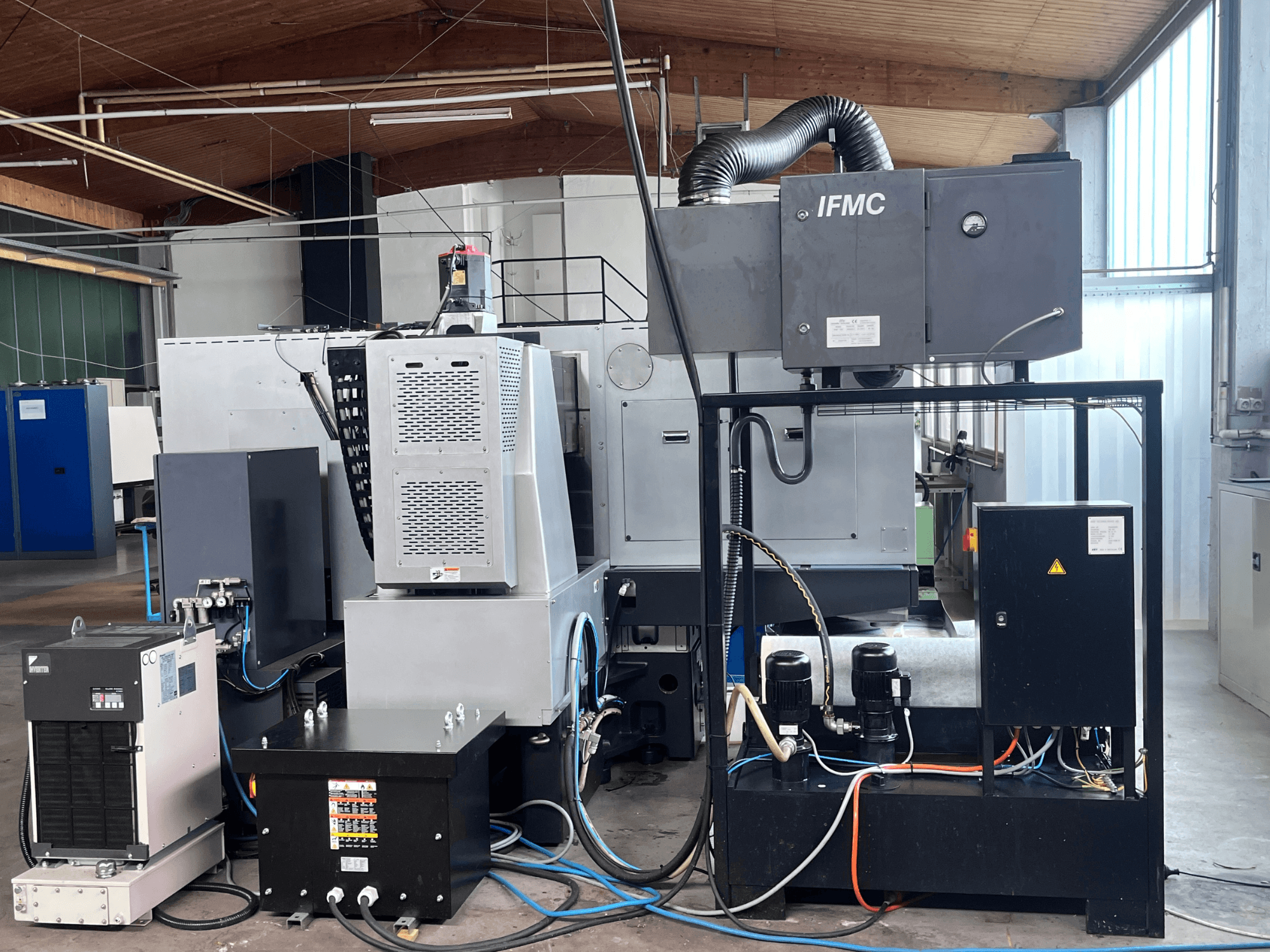 AMADA Techster 84 surface grinding machine, showcasing front view with cooling unit, motors, and integrated control panel.