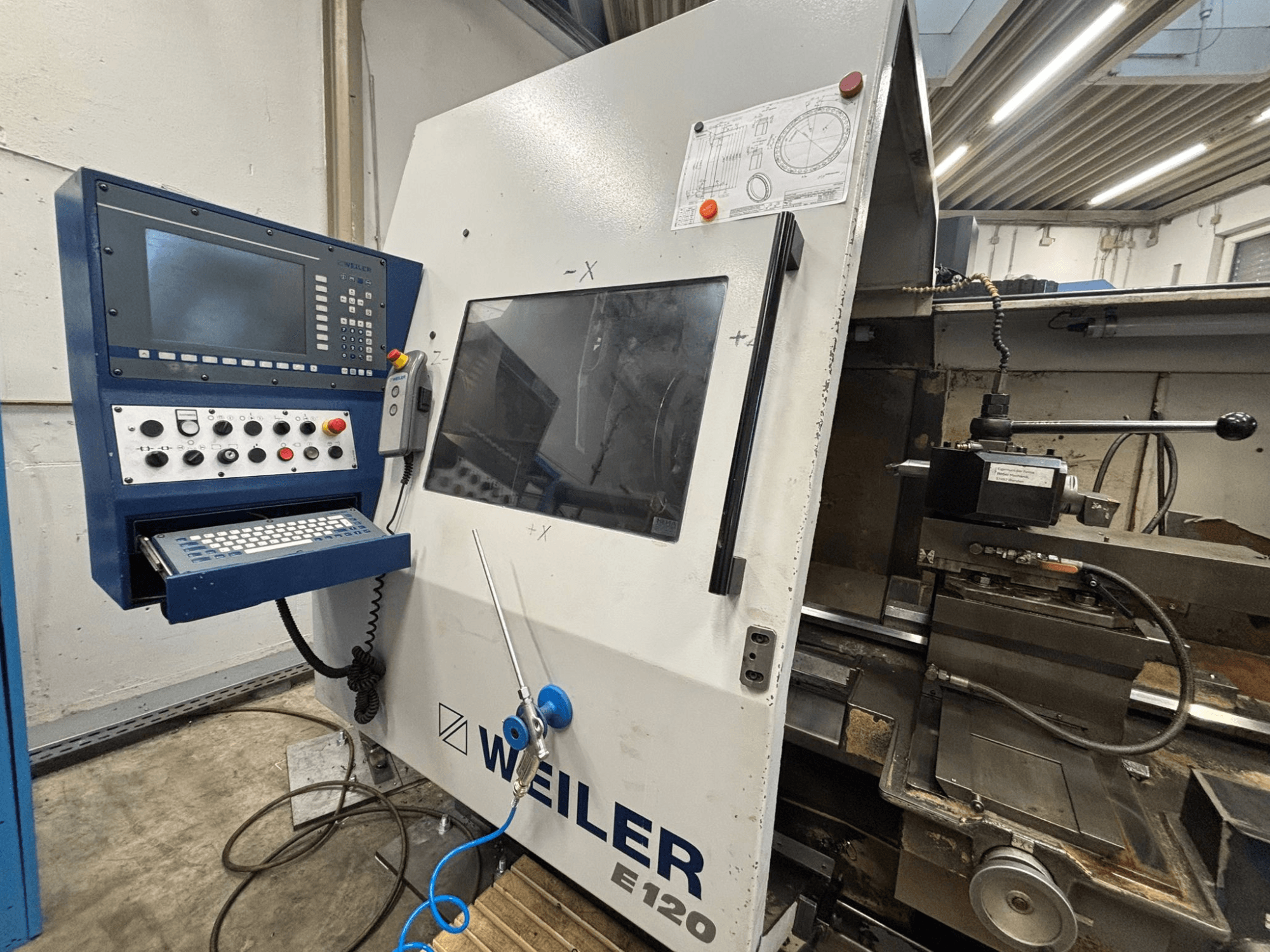 Weiler E-120 CNC machine control panel and interface, front view with visible buttons, display screen, and operating components.