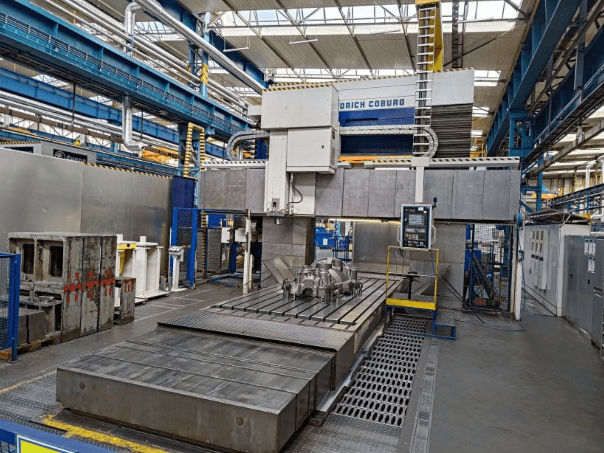 Gantry milling machine WALDRICH COBURG 17-10 FP NC/5 in a factory, front view, showcasing large machining table and control panel.