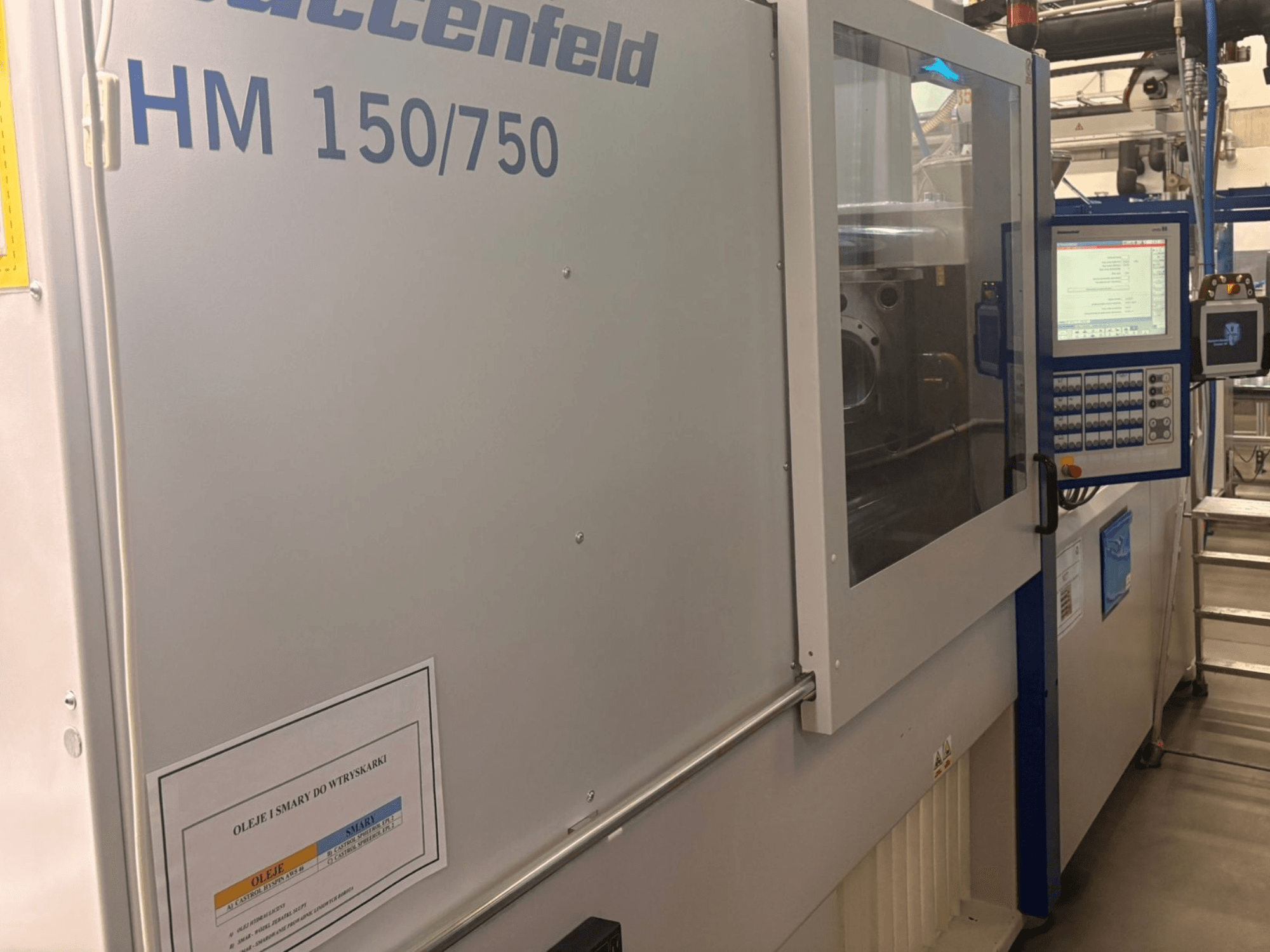 Hoffer Maschinenbau HM 150/750 injection molding machine, front view, showing control panel and operational display.