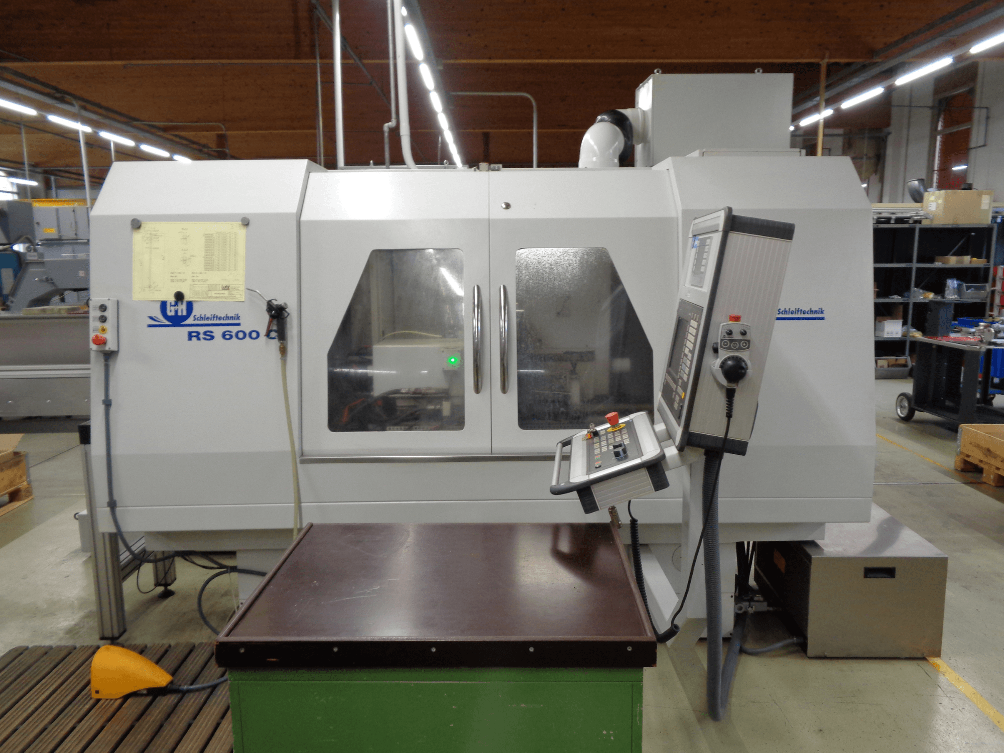 Cylindrical grinding machine GEIBEL & HOTZ RS 600 C, front view showing control panel and worktable in a factory setting.