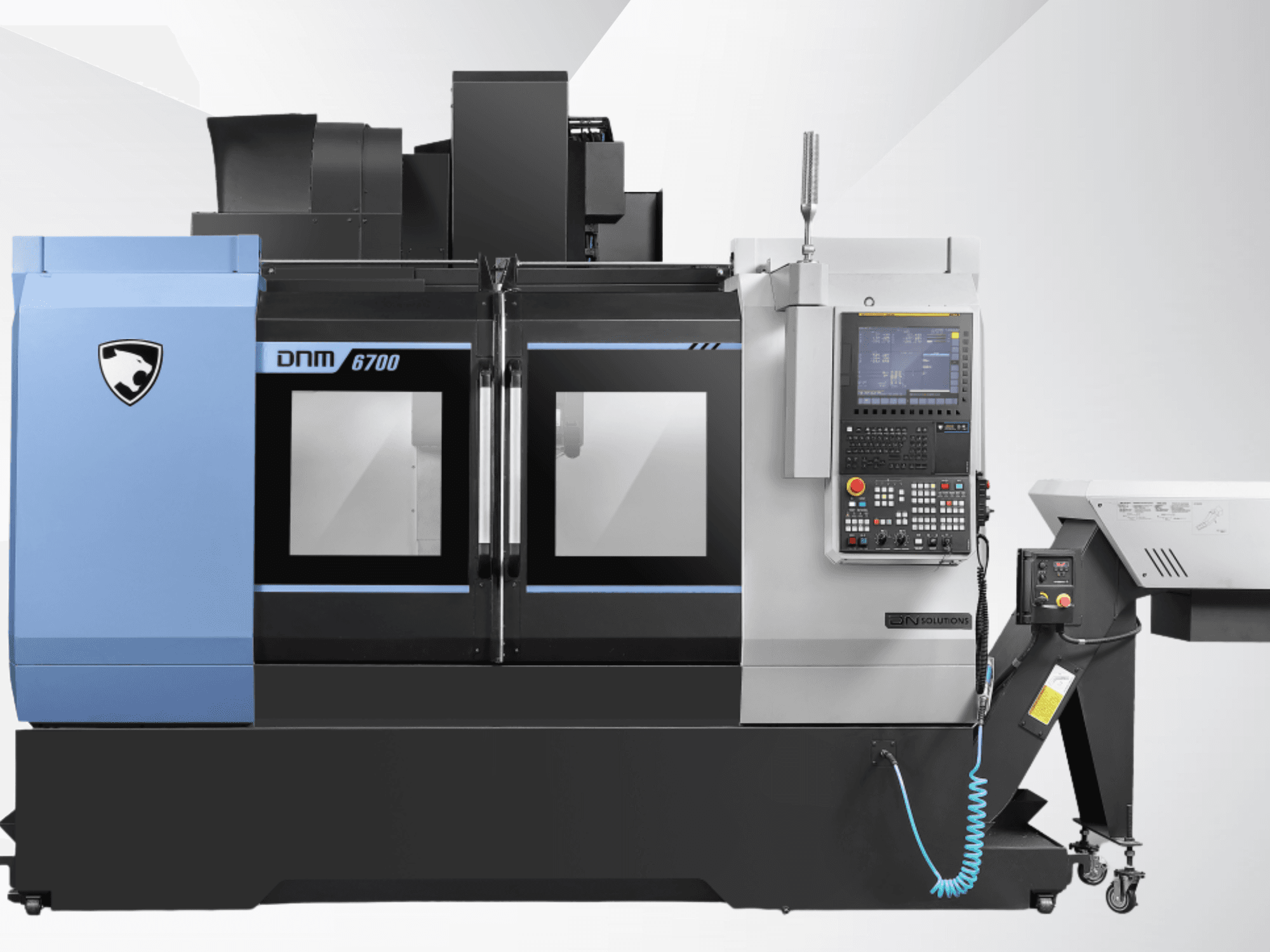 DN SOLUTIONS DNM 6700 Vertical Machining Centre shown from the front, featuring control panel and dual glass doors.
