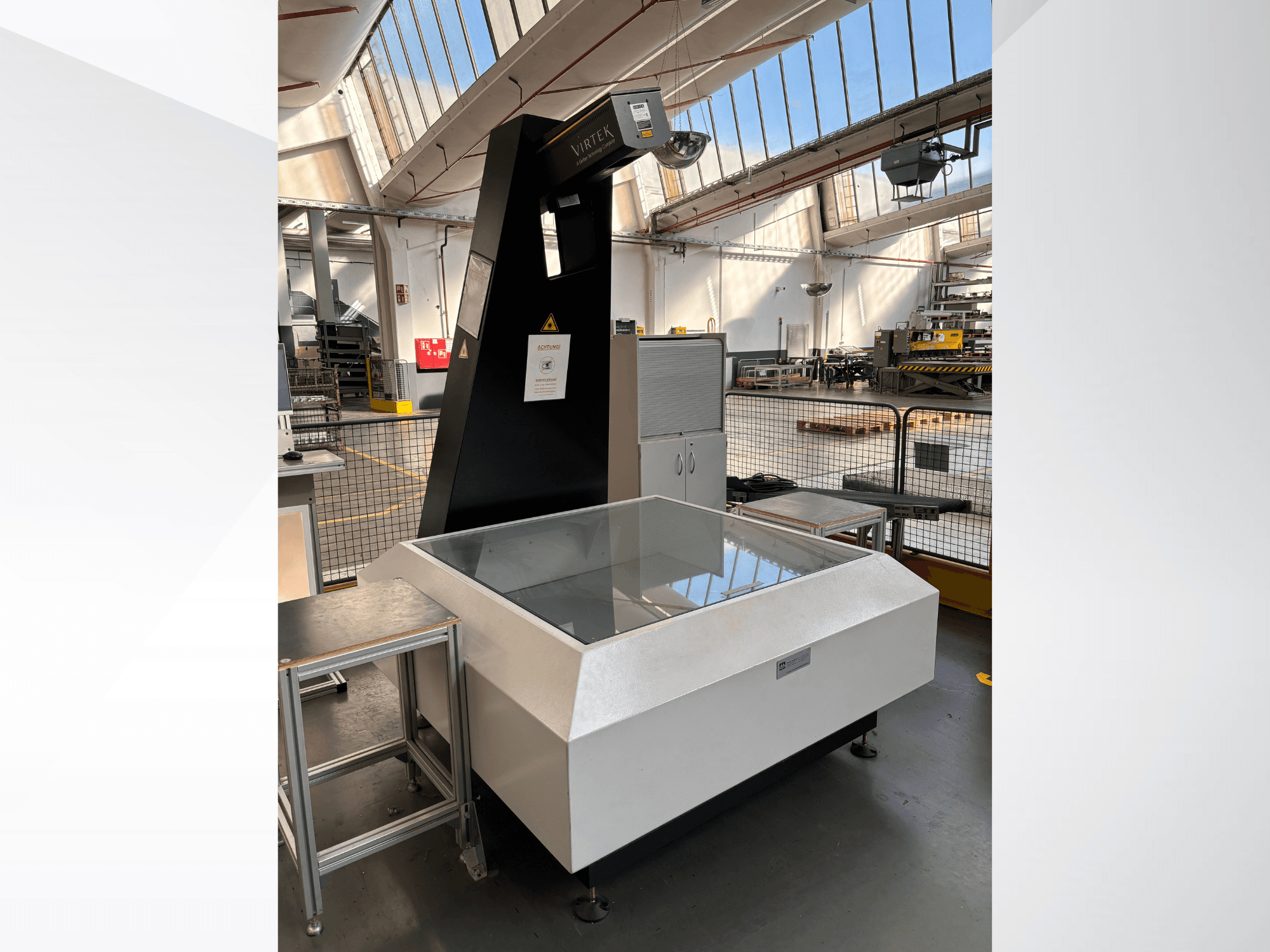 VIRTEK LPS-1EA Optical Measurement Machine in a factory setting, front view showing glass top and control panel.