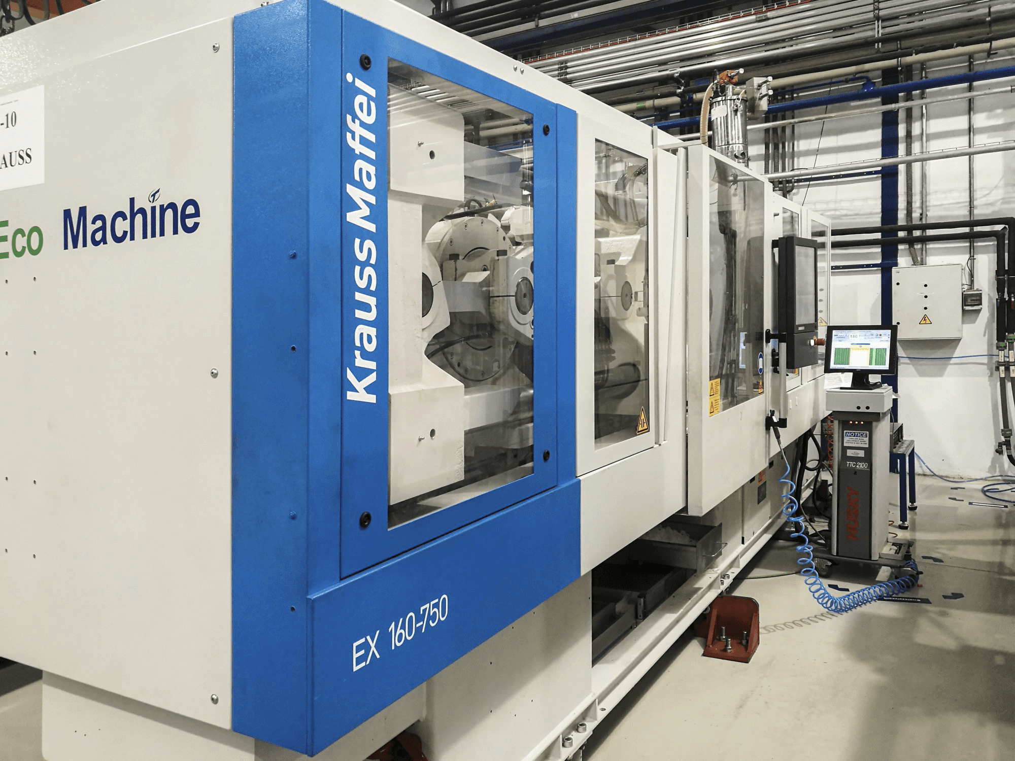 Left view of Krauss Maffei 160-750 EX Machine