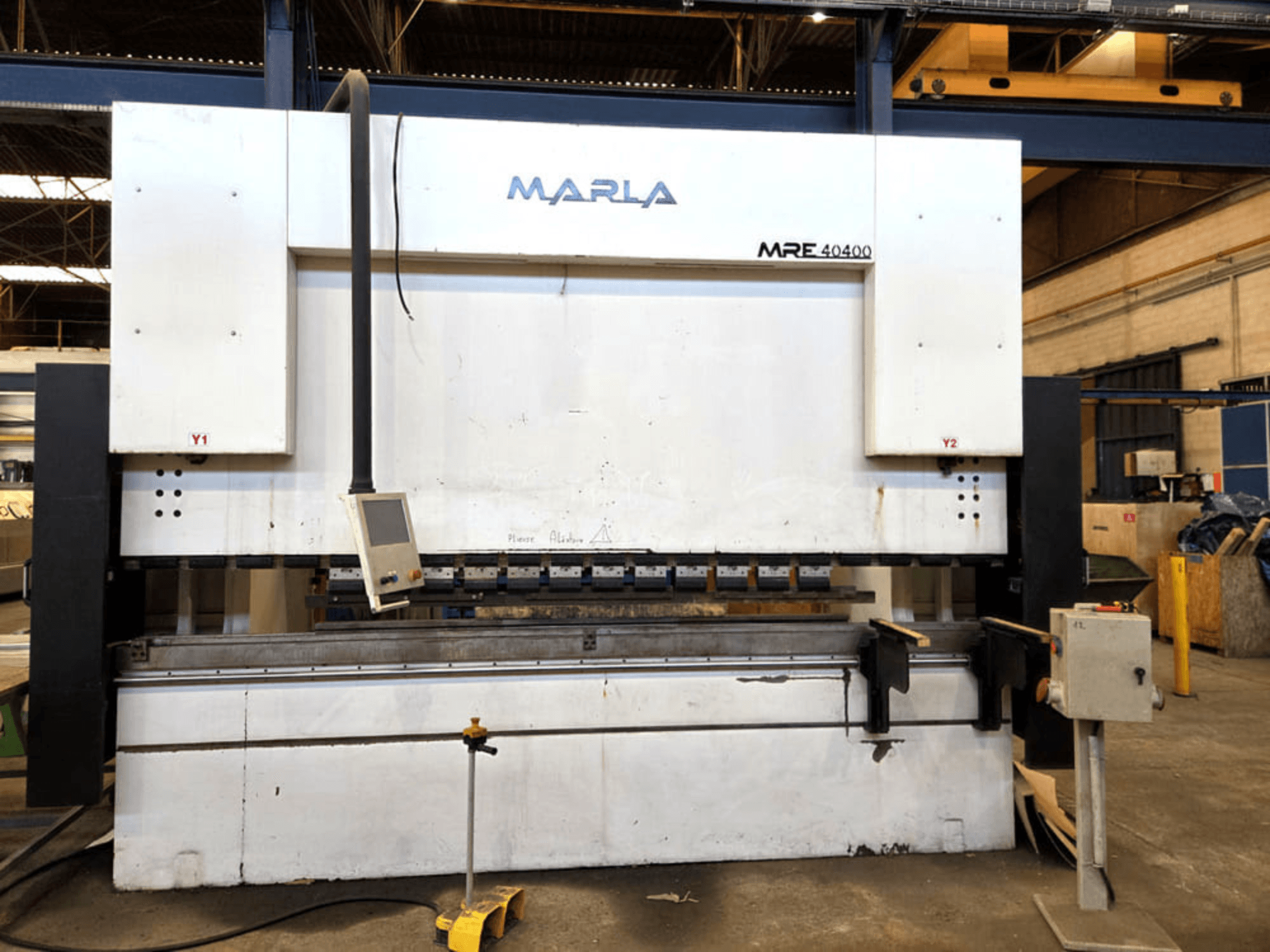 Front view of MARLA MRE.40400 press brake, featuring control panel, hydraulic system, and workbench area.