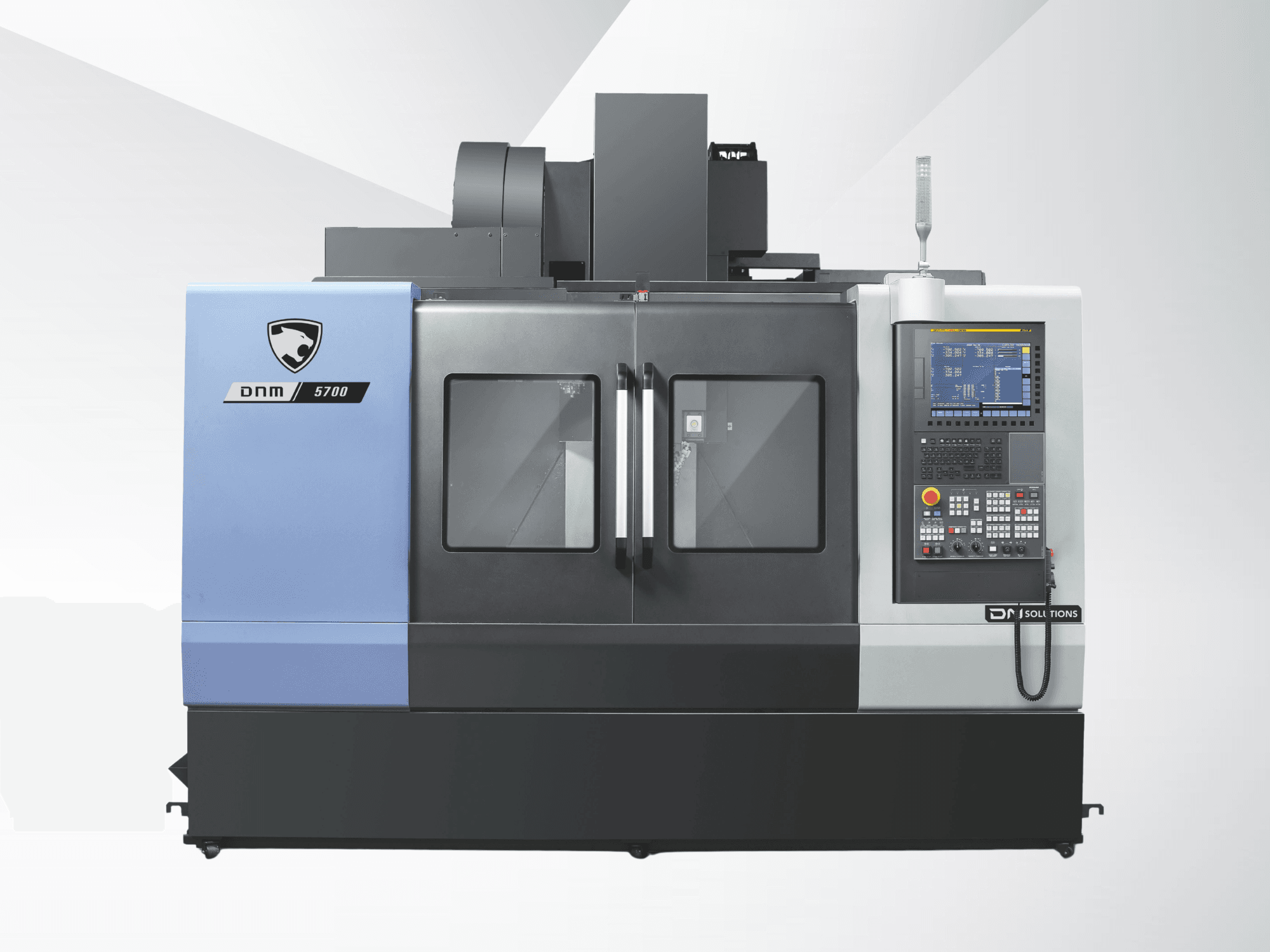 Front view of DN SOLUTIONS DNM 5700 vertical machining center, showcasing control panel and large viewing windows.