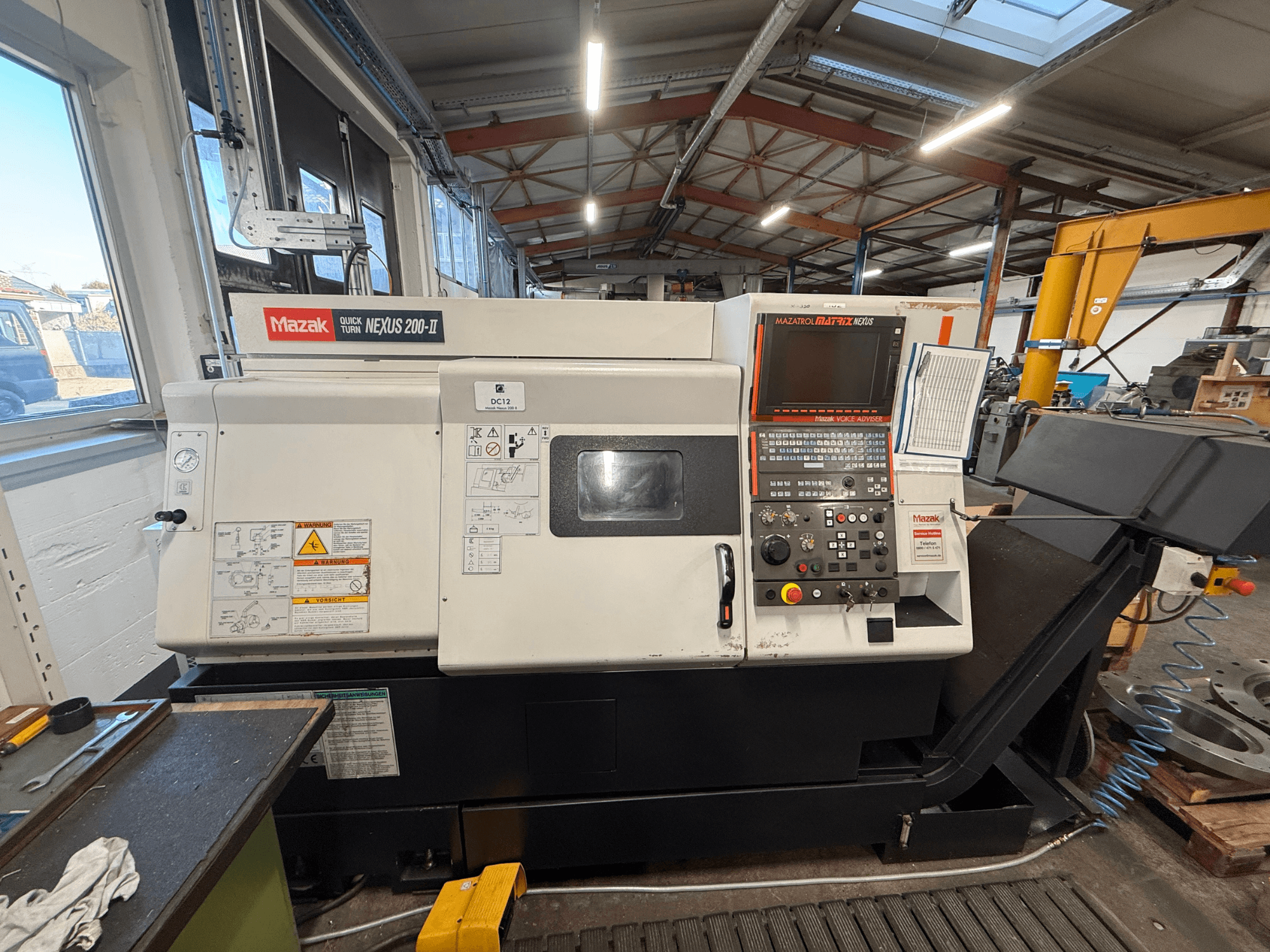 Mazak QUICK TURN NEXUS 200-II horizontal turning machine, front view, showcasing control panel and operational features.