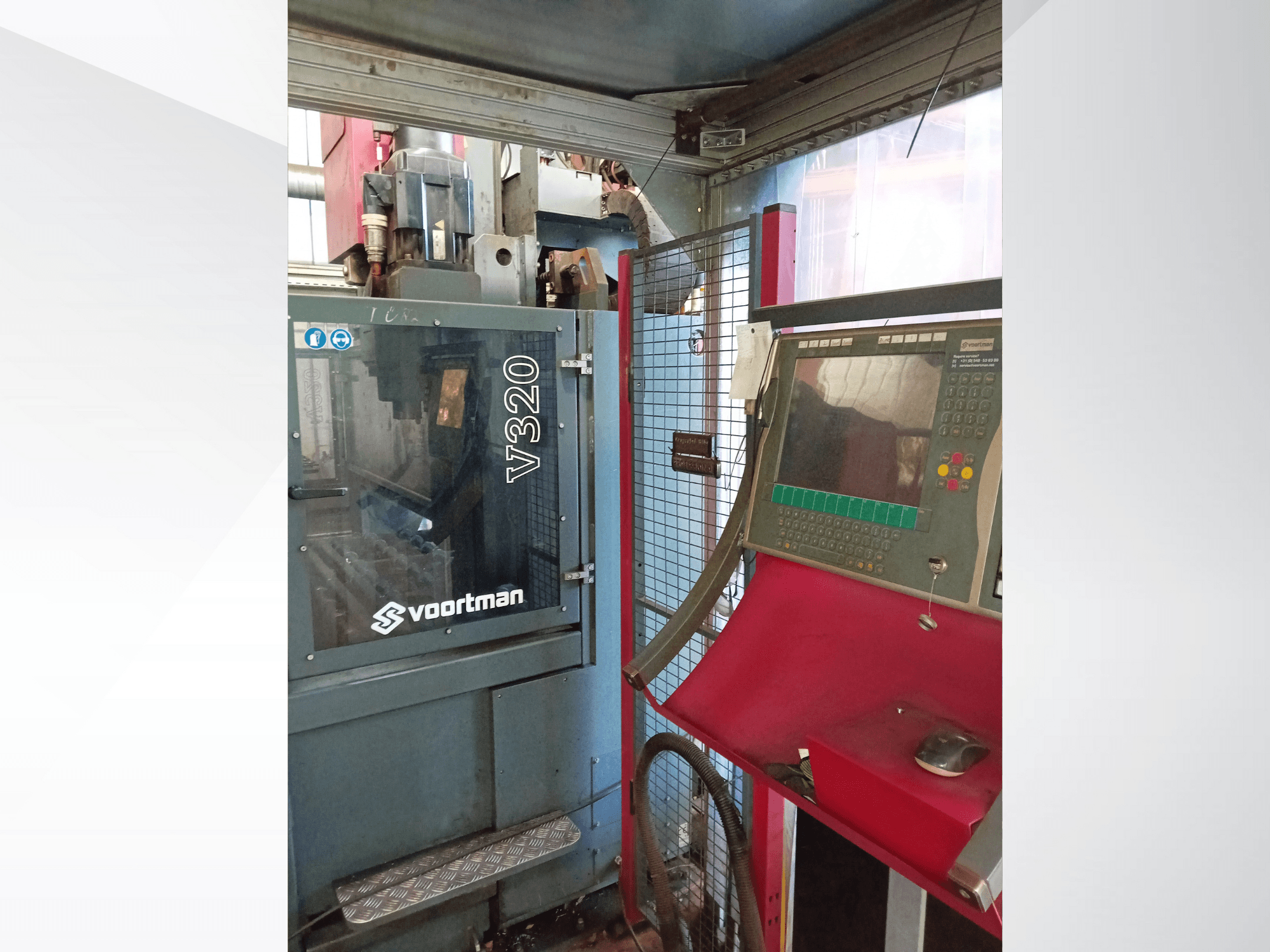Voortman V320 CNC machine front view, featuring control panel with buttons, display screen, and safety mesh enclosure.