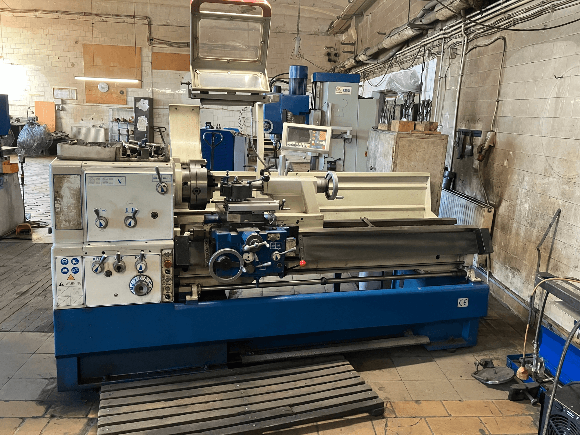 KNUTH Turnado 280/1500 horizontal turning machine, front view showing control panel, spindle, and tool holder, in workshop setting.
