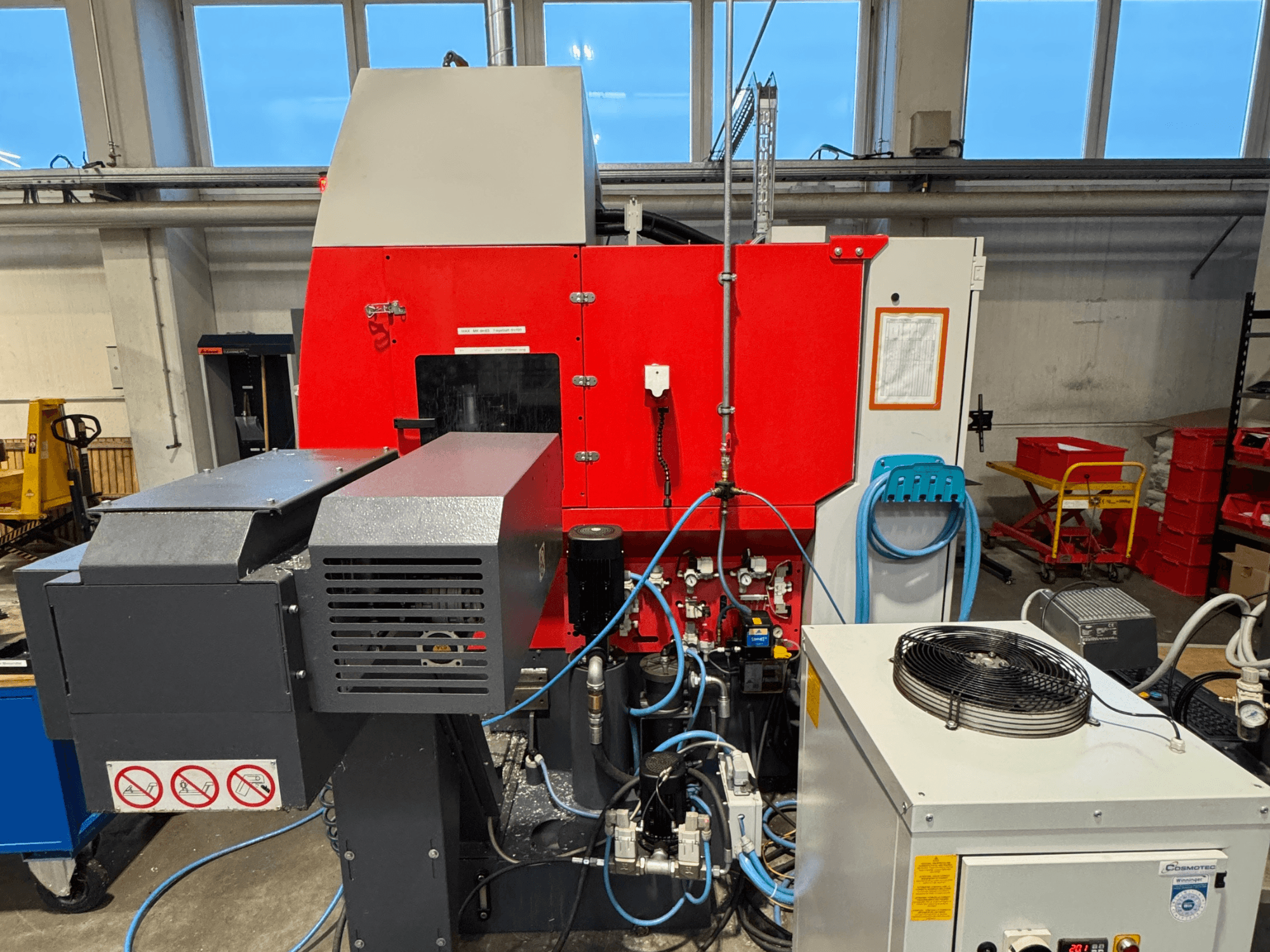 EMCO MAXXMILL 350 vertical machining center, front view, showcasing complex machinery and control panel details.