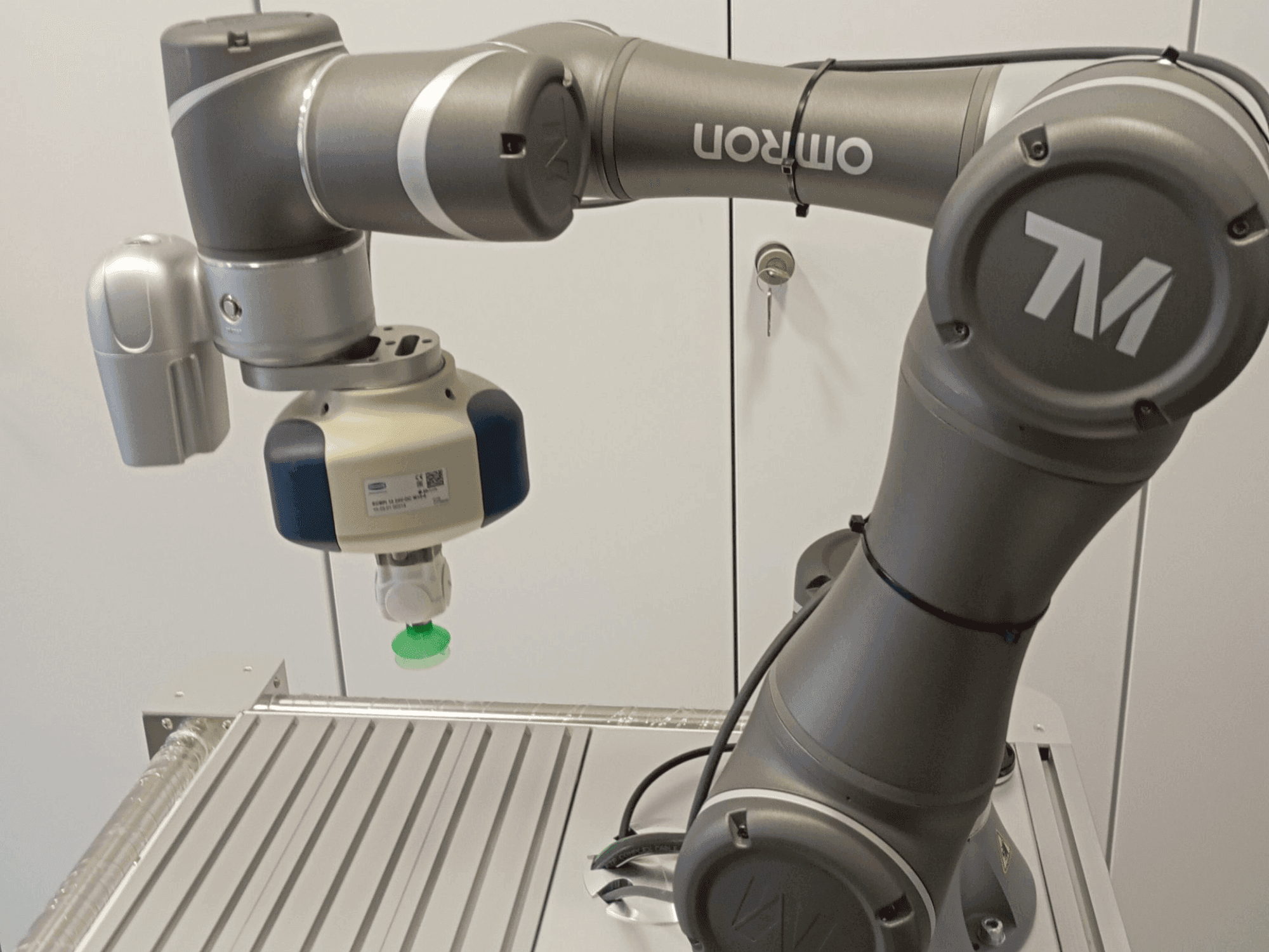 Front view of OMRON TM5-700 machine