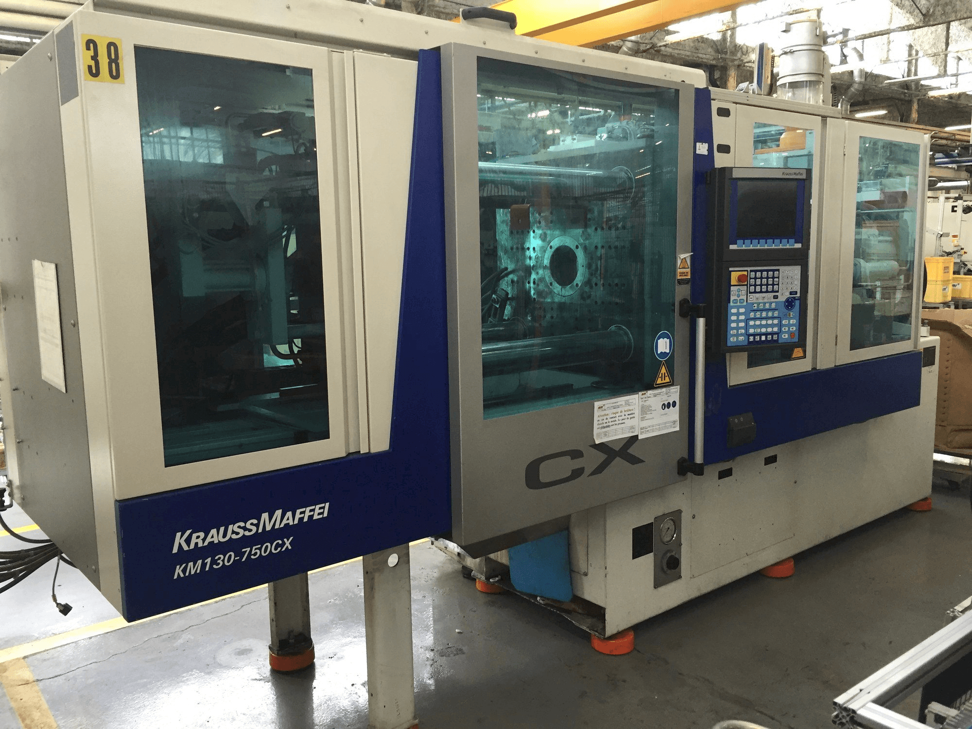 Front view of Krauss Maffei 130-750 CX machine