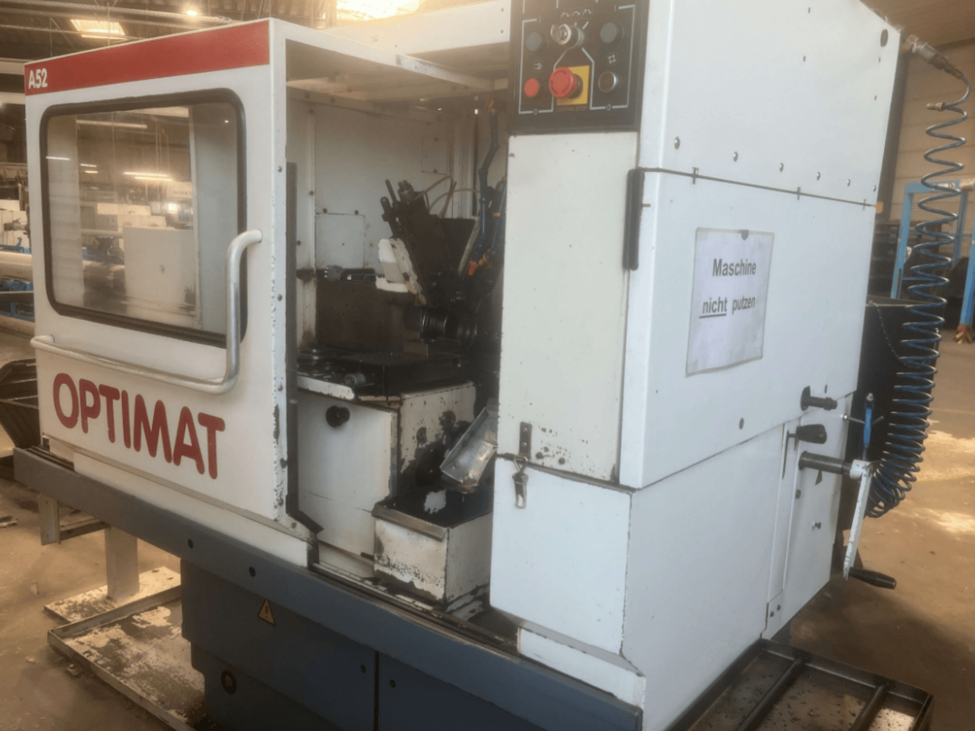 KOVOSVIT MAS Optimat A52 vertical machining centre, side view showcasing control panel and interior workspace.