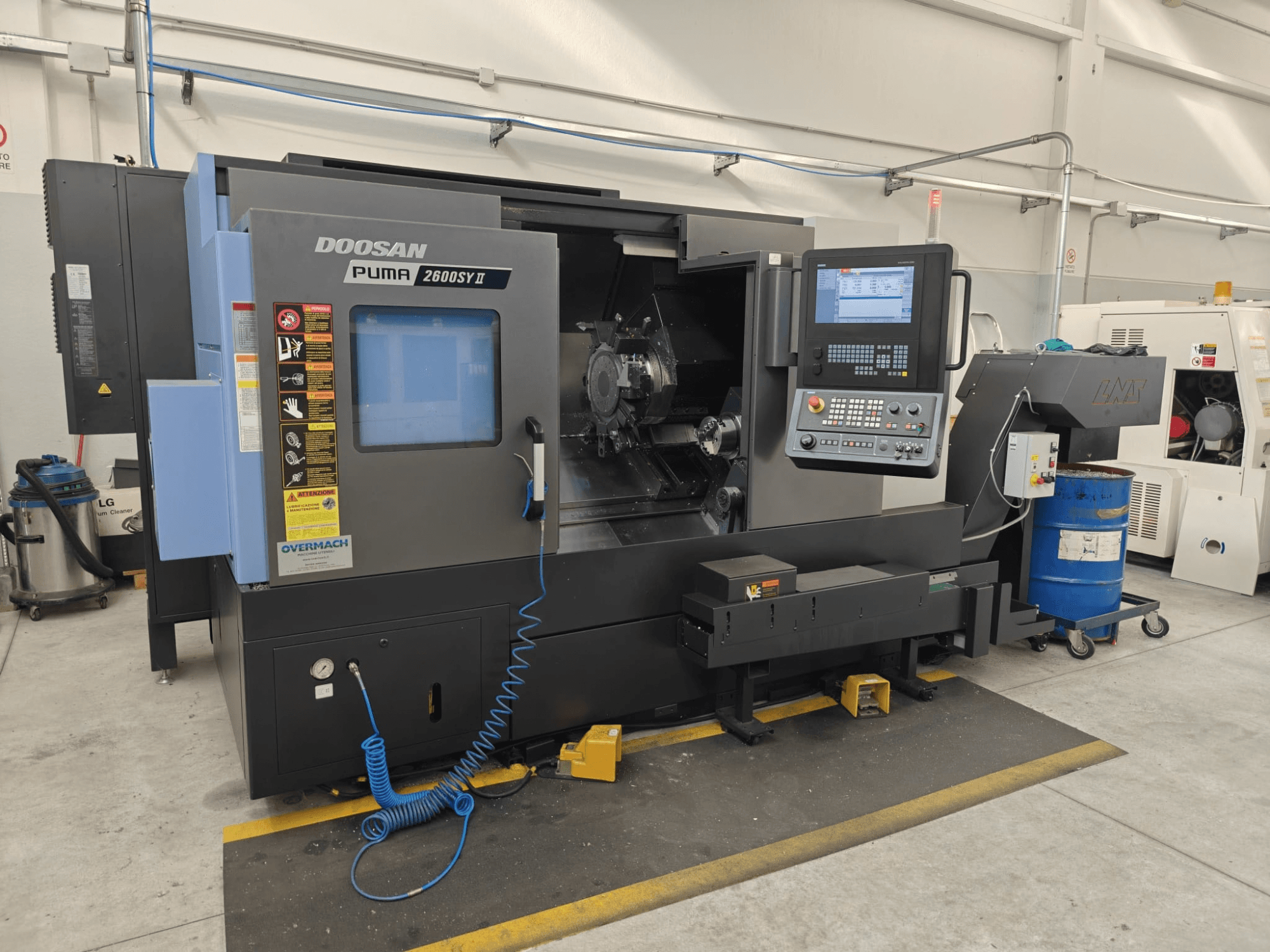 DOOSAN Puma 2600 SY II horizontal turning machine, front view, featuring control panel and operational indicators.