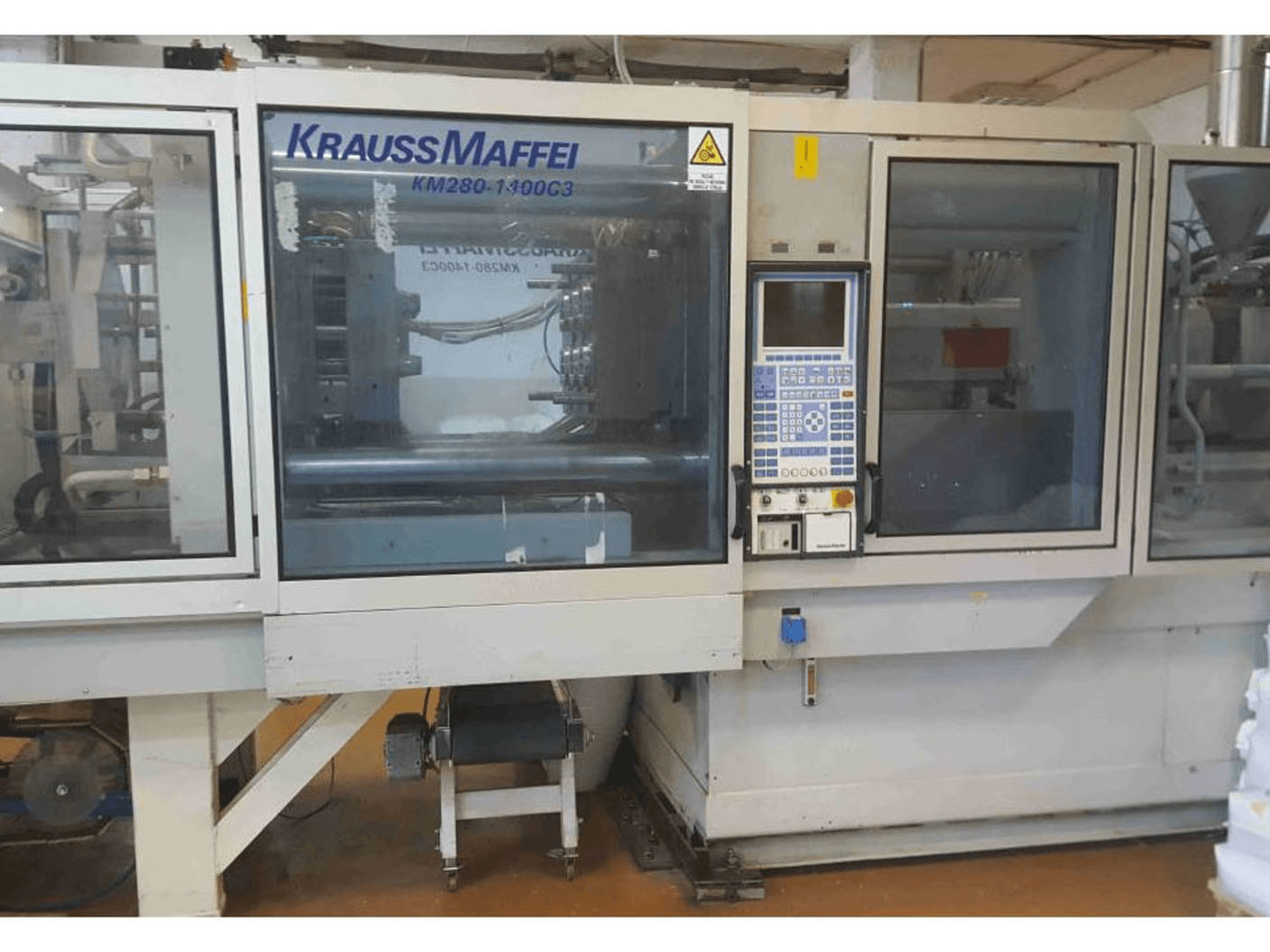 Front view of Krauss Maffei KM 280-1400 C3 machine
