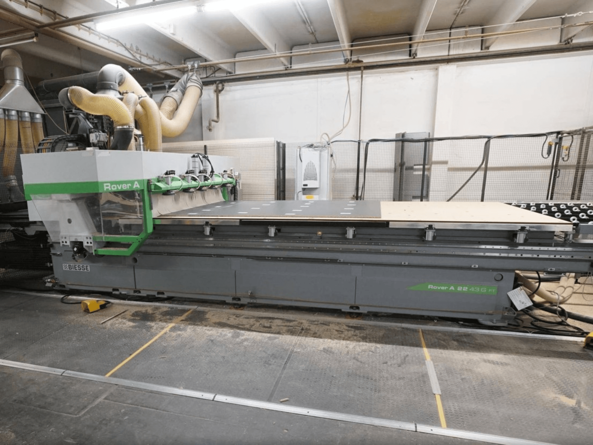 CNC wood machining centre BIESSE Rover A FT 2243, front view, features a large worktable and tool attachment system.
