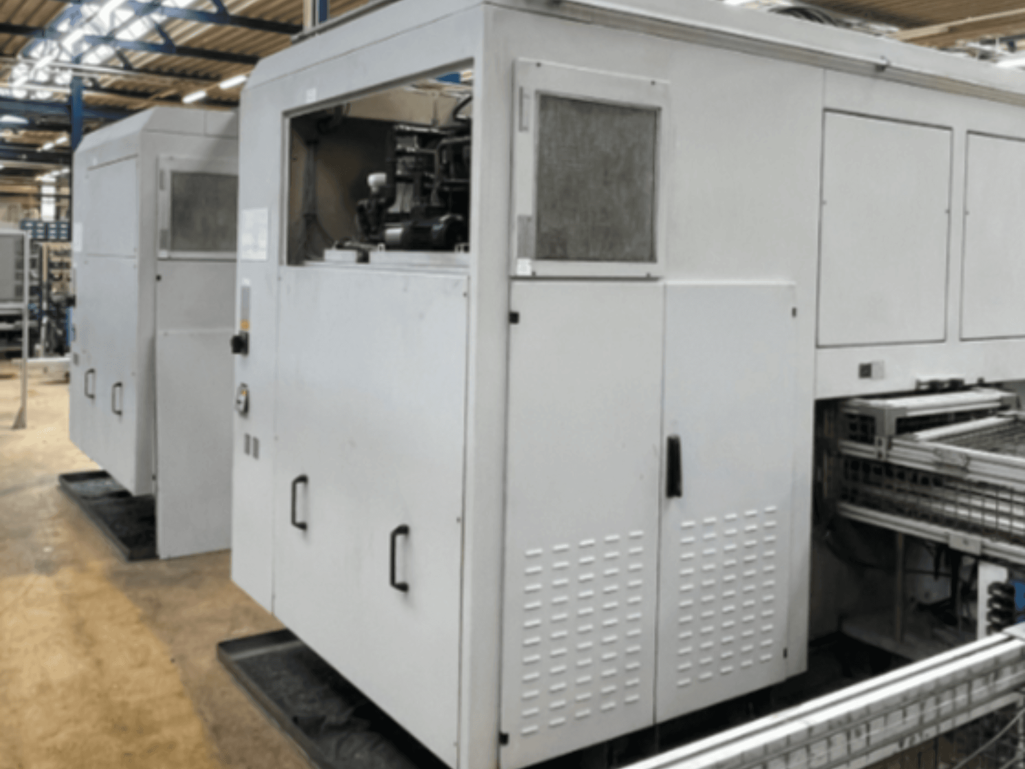 EMAG VSC 200 TWIN OP 10 vertical turning machine, side view, showcasing its robust structure and operational features.