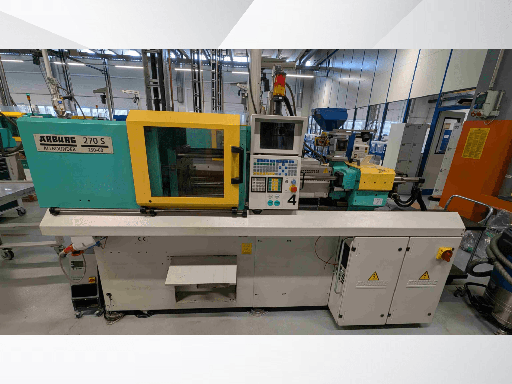 Arburg 270 S 400-60 hydraulic injection molding machine in front view, featuring control panel and safety elements.