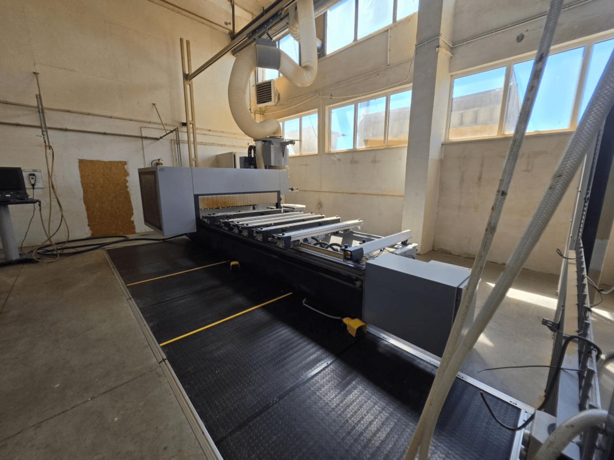 CNC Processing Center FORMAT4 PROFIT H350 16.30 from a side view, featuring a sleek design and operational workspace.