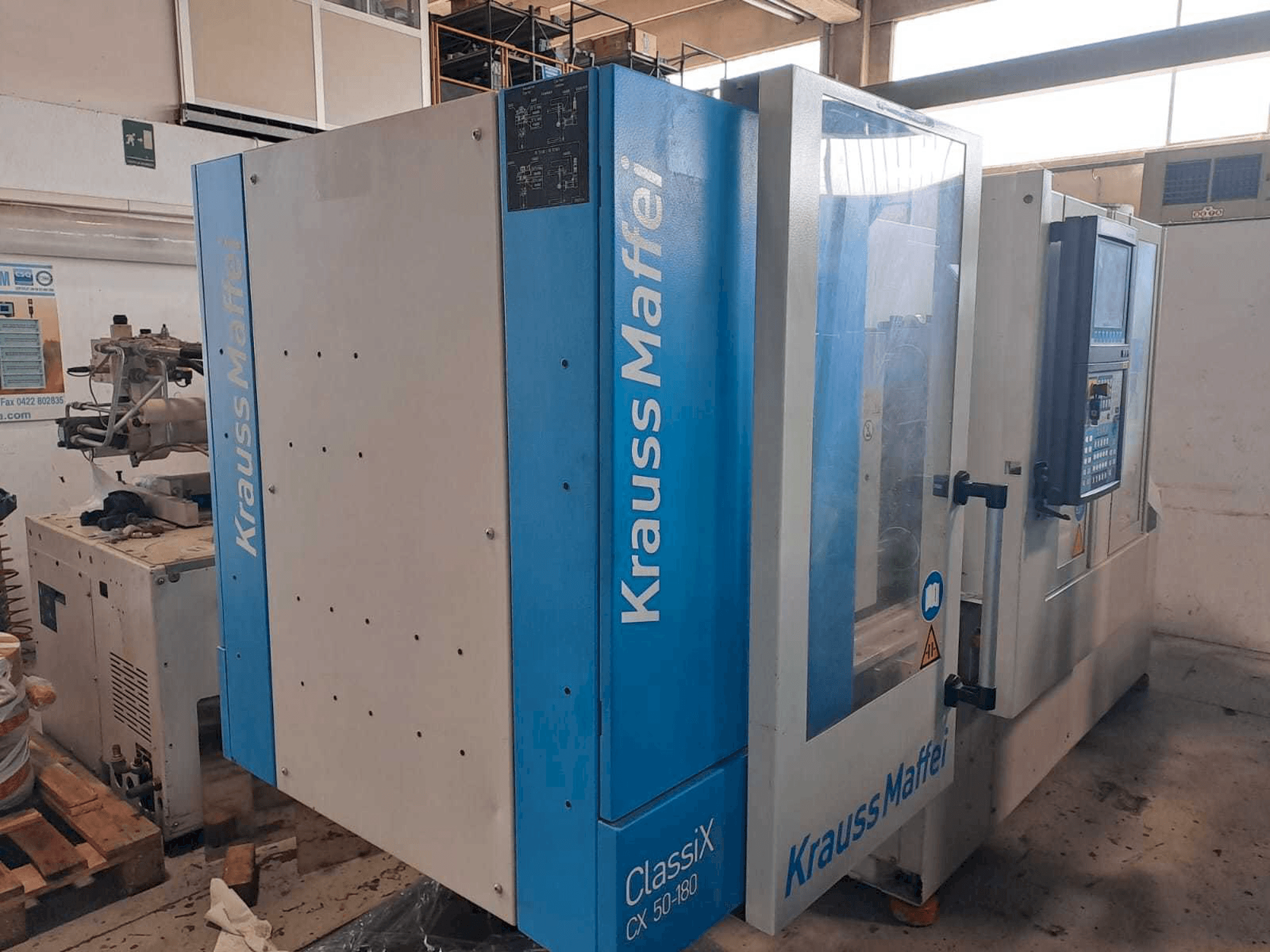 Left view of Krauss Maffei 50-180CX machine