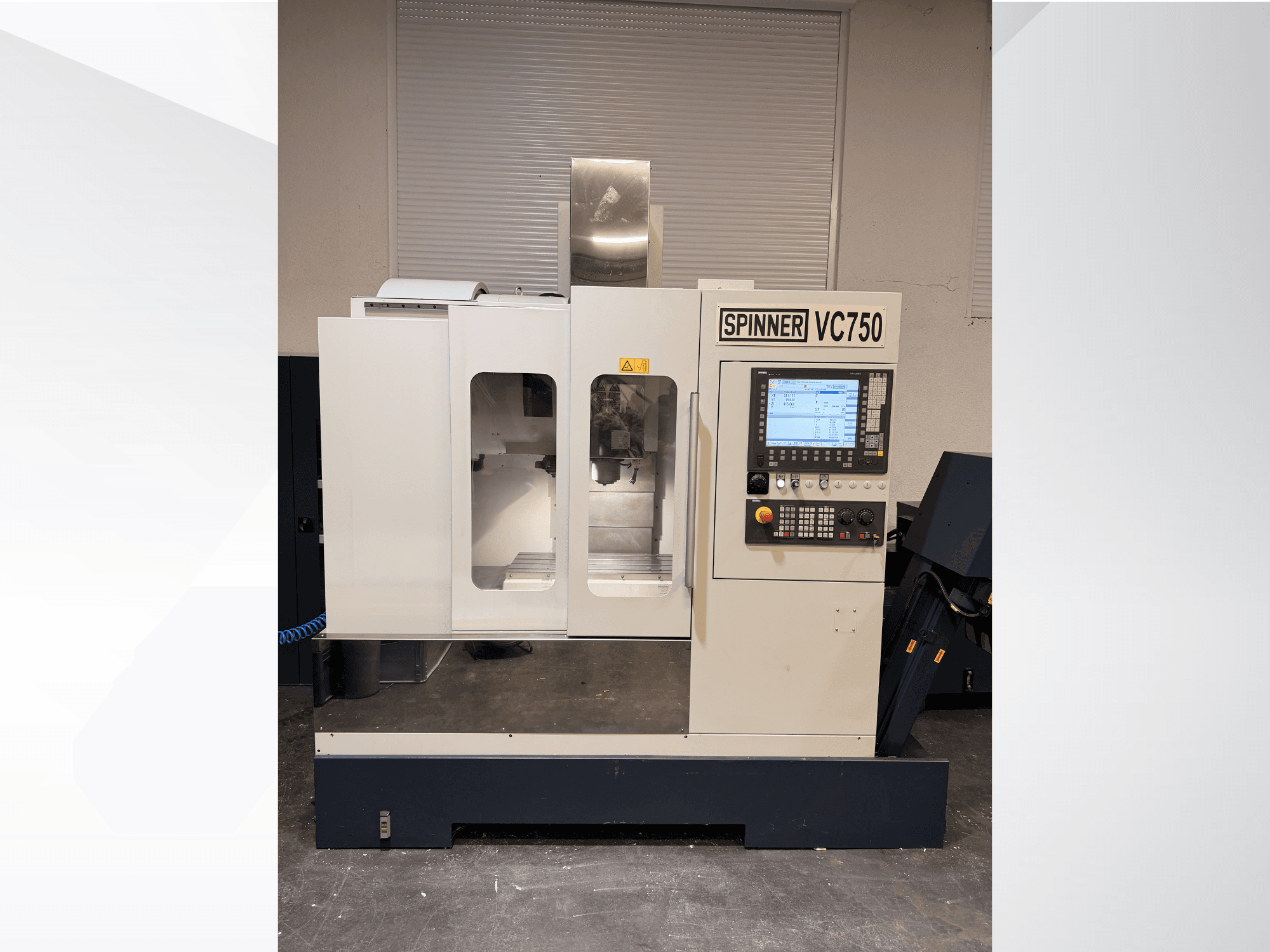 Spinner VC750 CNC machine in front view, featuring control panel, machining area, and cooling system.