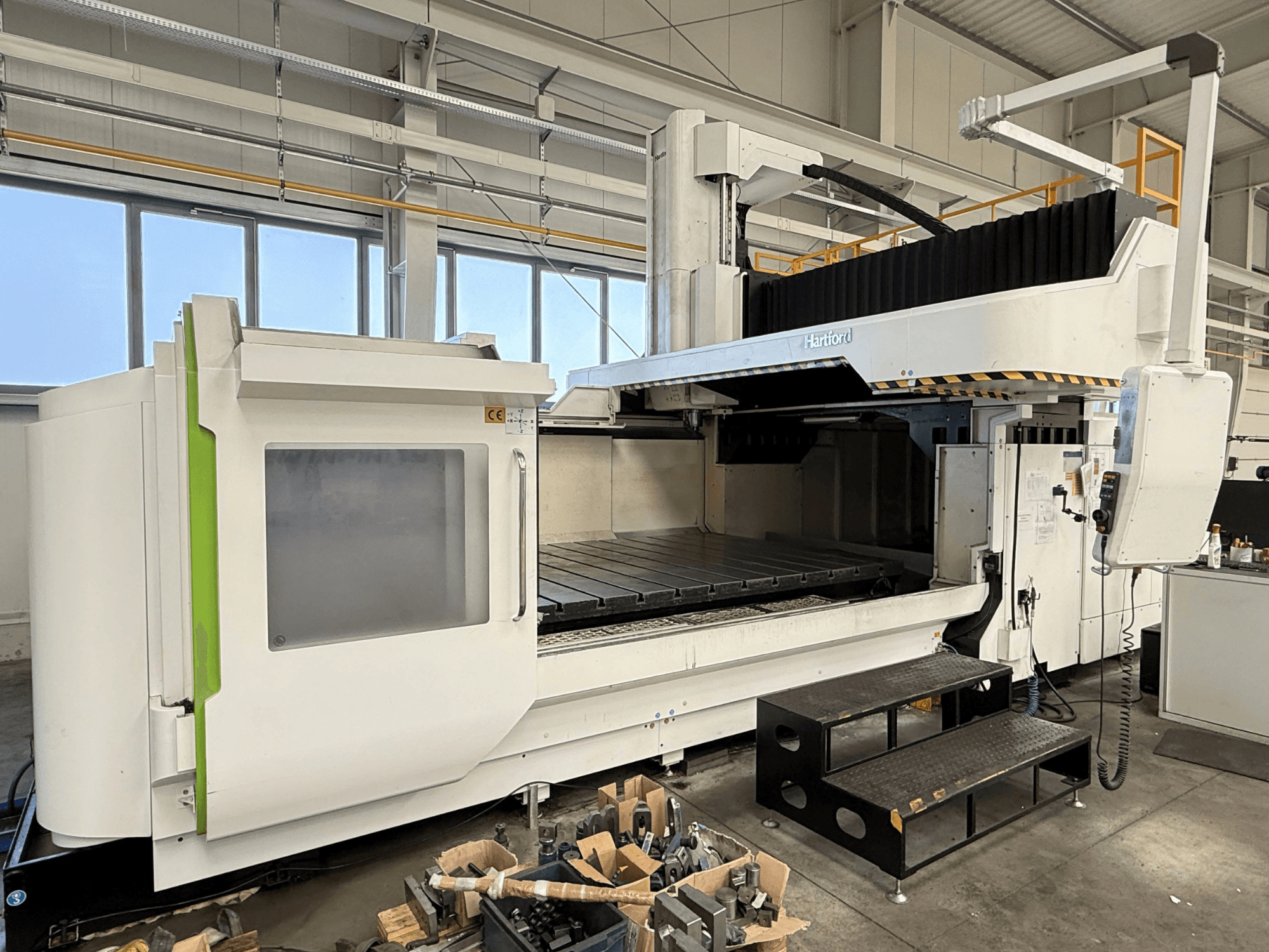 Front view of the Hartford HSA-323 gantry milling machine, showcasing its large workspace and control console.