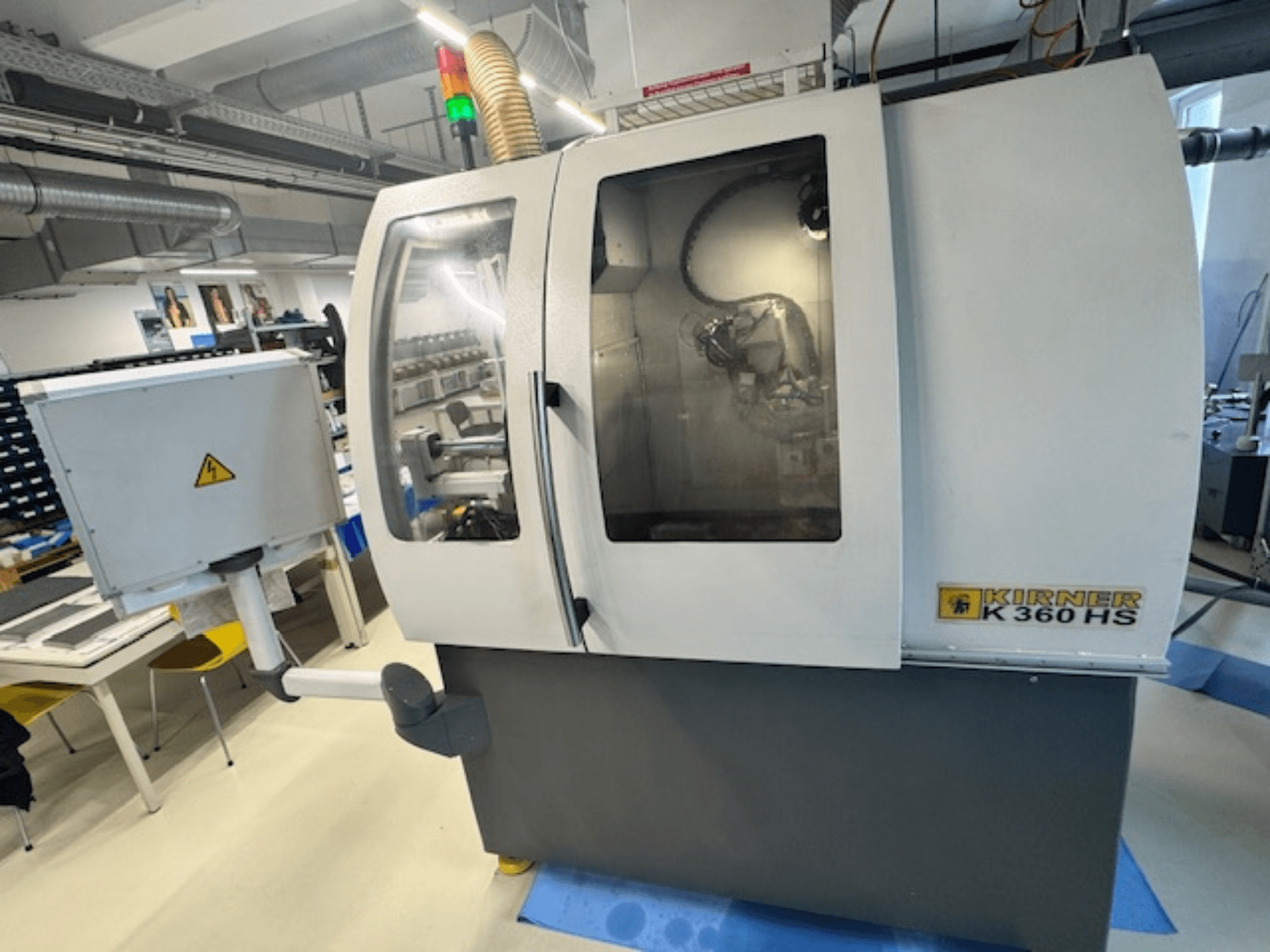 Cylindrical Grinding Machine KIRNER K 360 HS, front view, showcasing control panel and transparent protective enclosure.