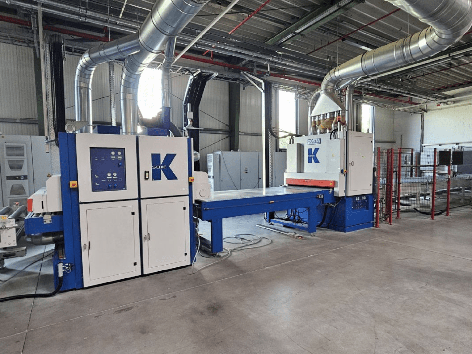 BURKLE EKMH 1300 laminating press in front view, featuring control panel and large pressing plate in an industrial setting.