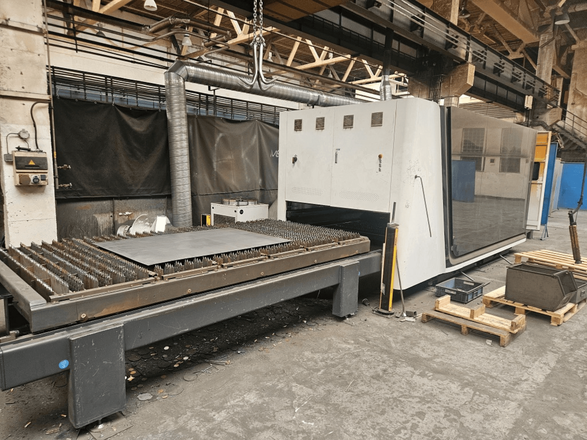 Bodor P3-G3 fiber laser cutting machine viewed from the front, showcasing the cutting table and control panel.