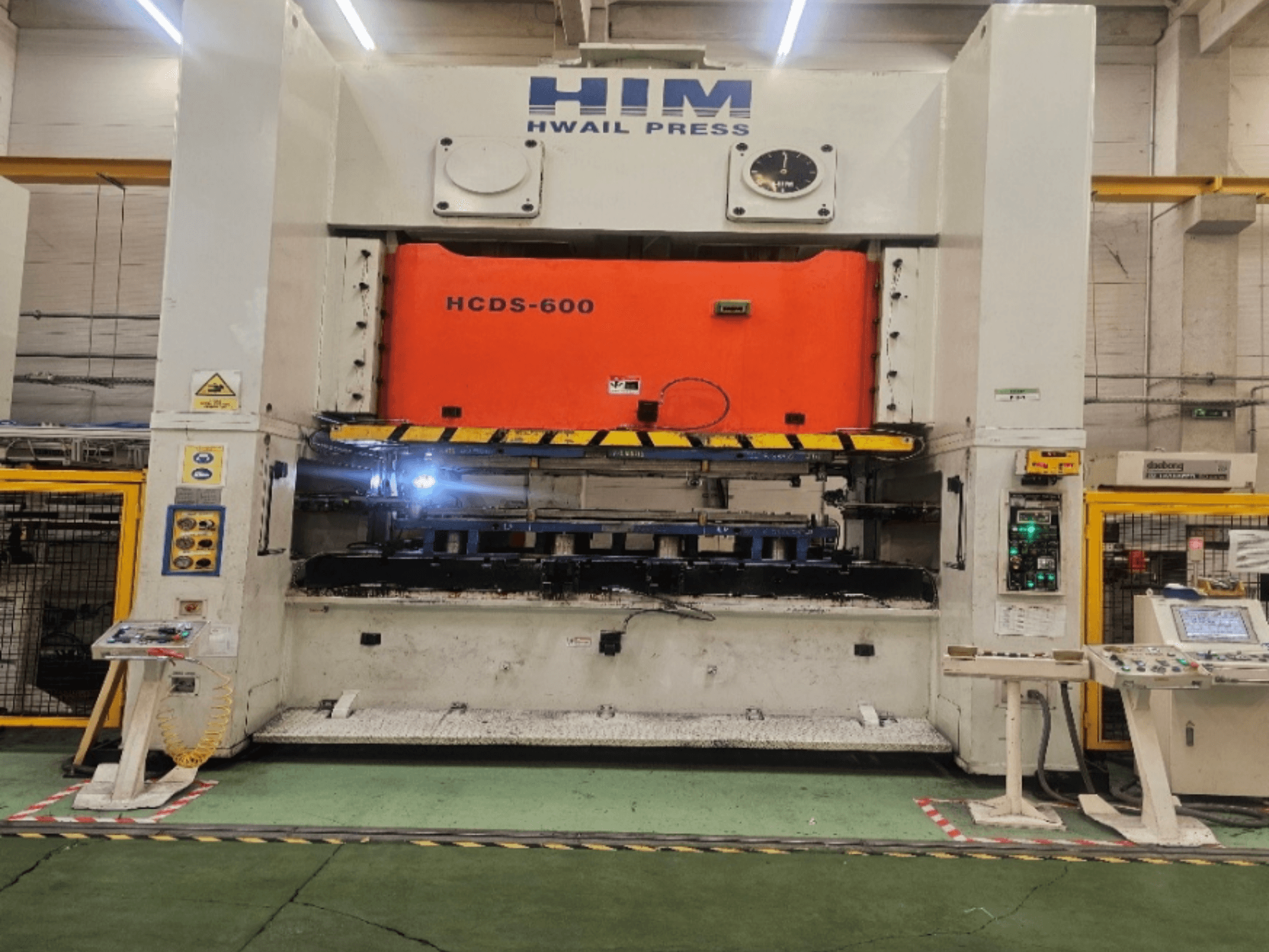 HIM HWAIL PRESS HCDS-600 mechanical stamping press front view, featuring an orange press plate and control panel.