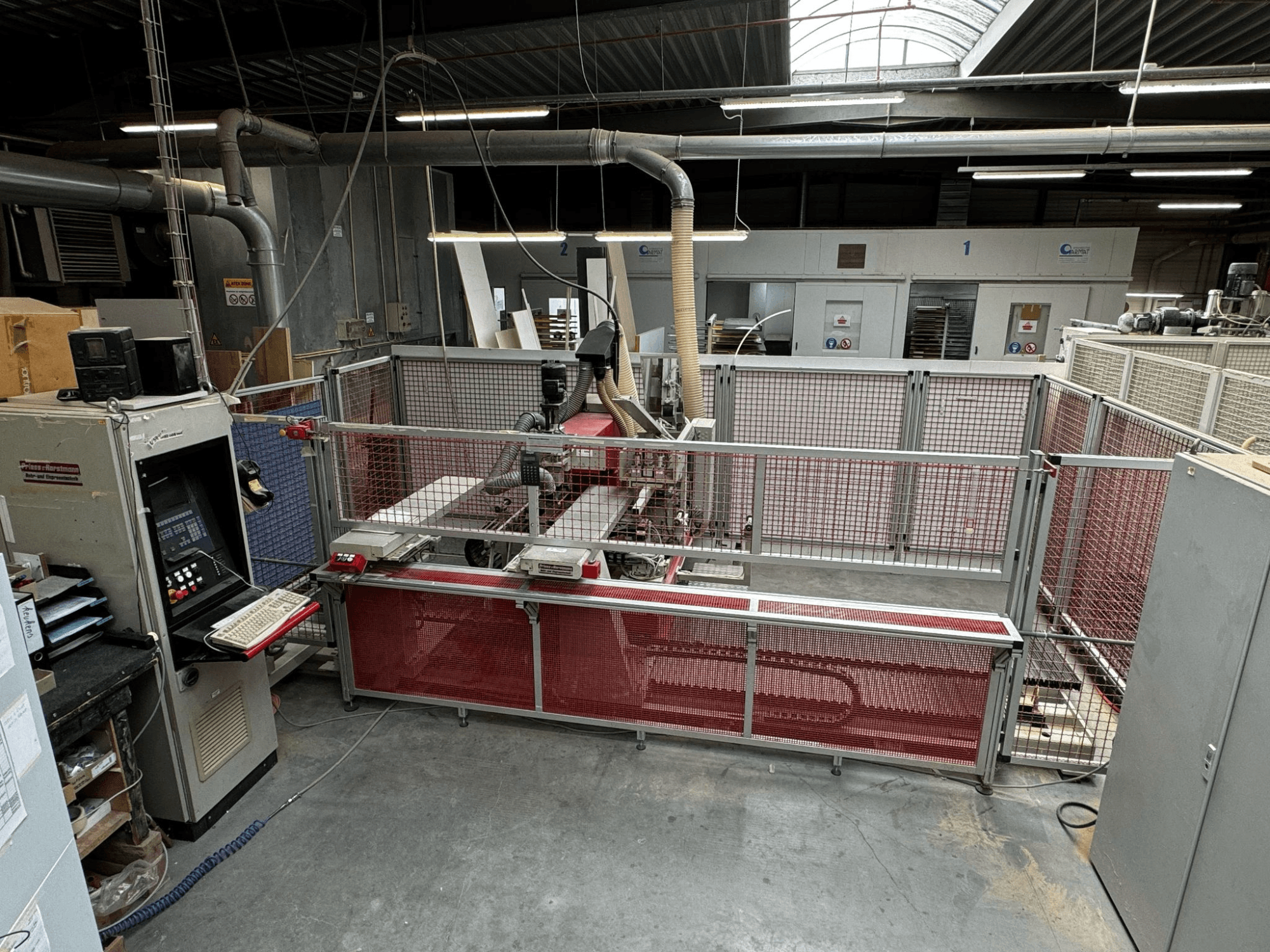 Multi-spindle drilling machine BAT-III-CNC by PREISS U HORTSTMANN, viewed from above with control panel and safety barriers.