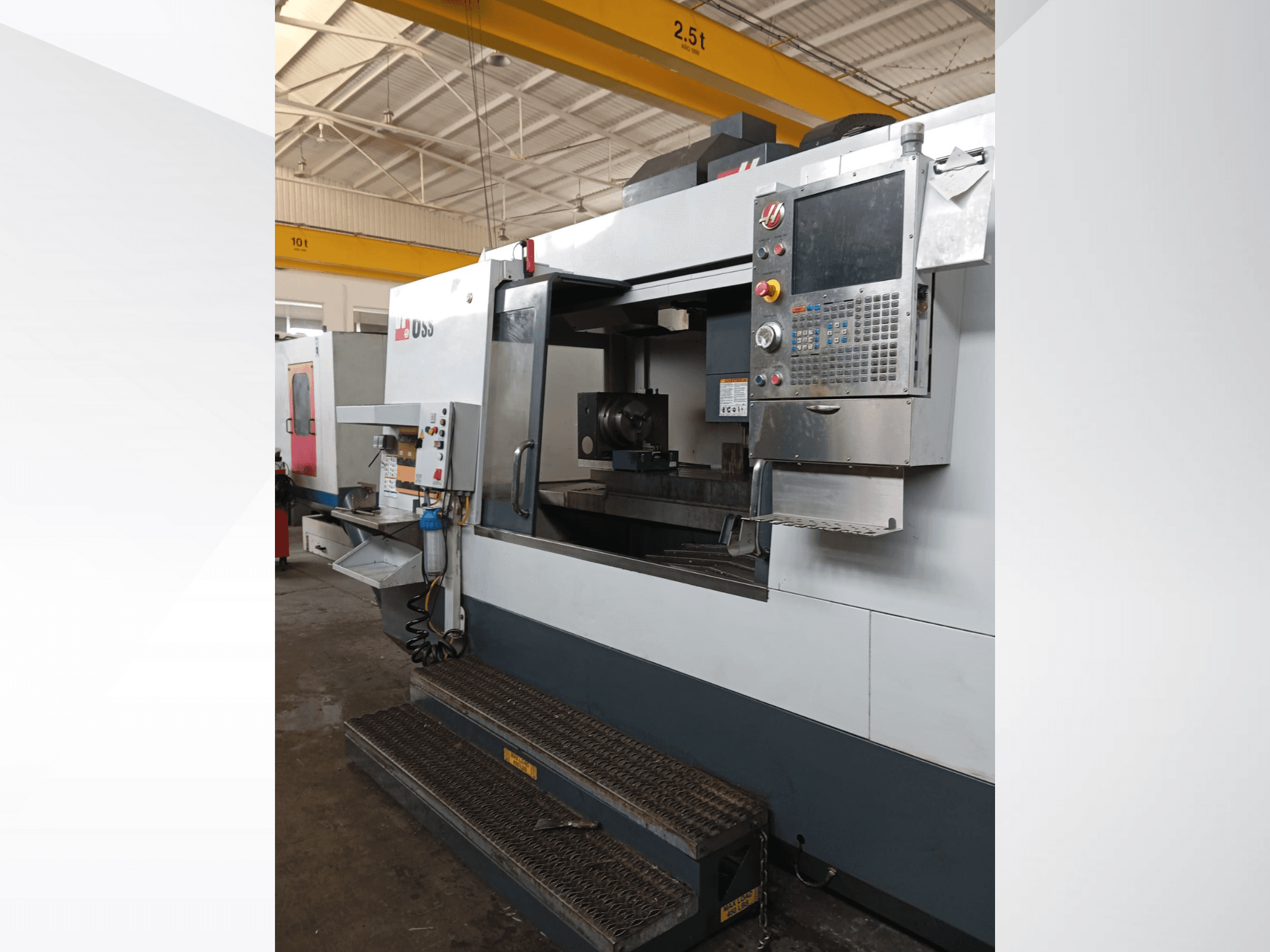 Haas CNC milling machine, front view, showing control panel, work area, and detailed steps for access.