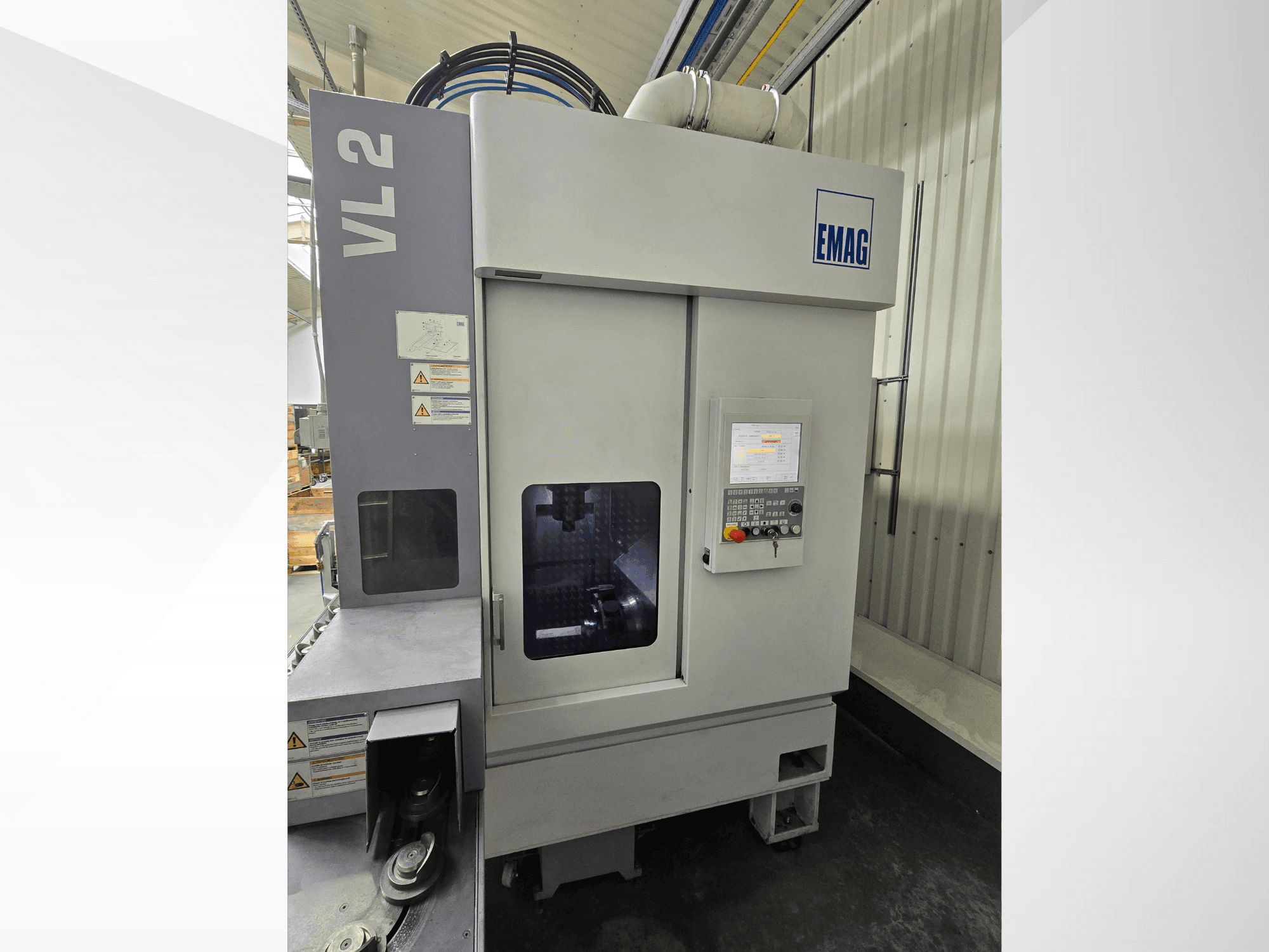 EMAG VL 2 precision machine from a front view, featuring a digital control panel and viewing window for operation checks.