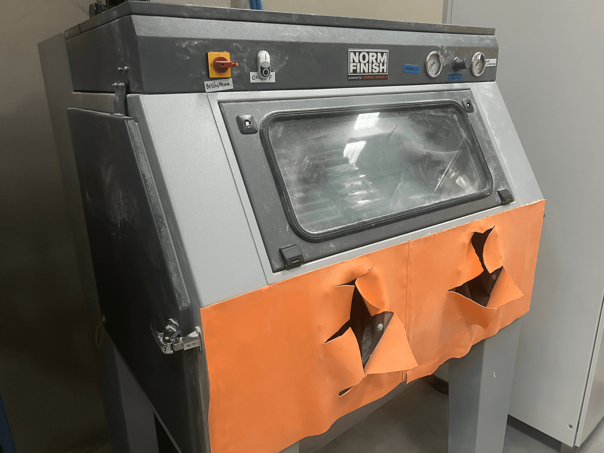 EOS P 396 plastic 3D printer in grey, side view with worn orange cover and visible control panel, dusty condition.