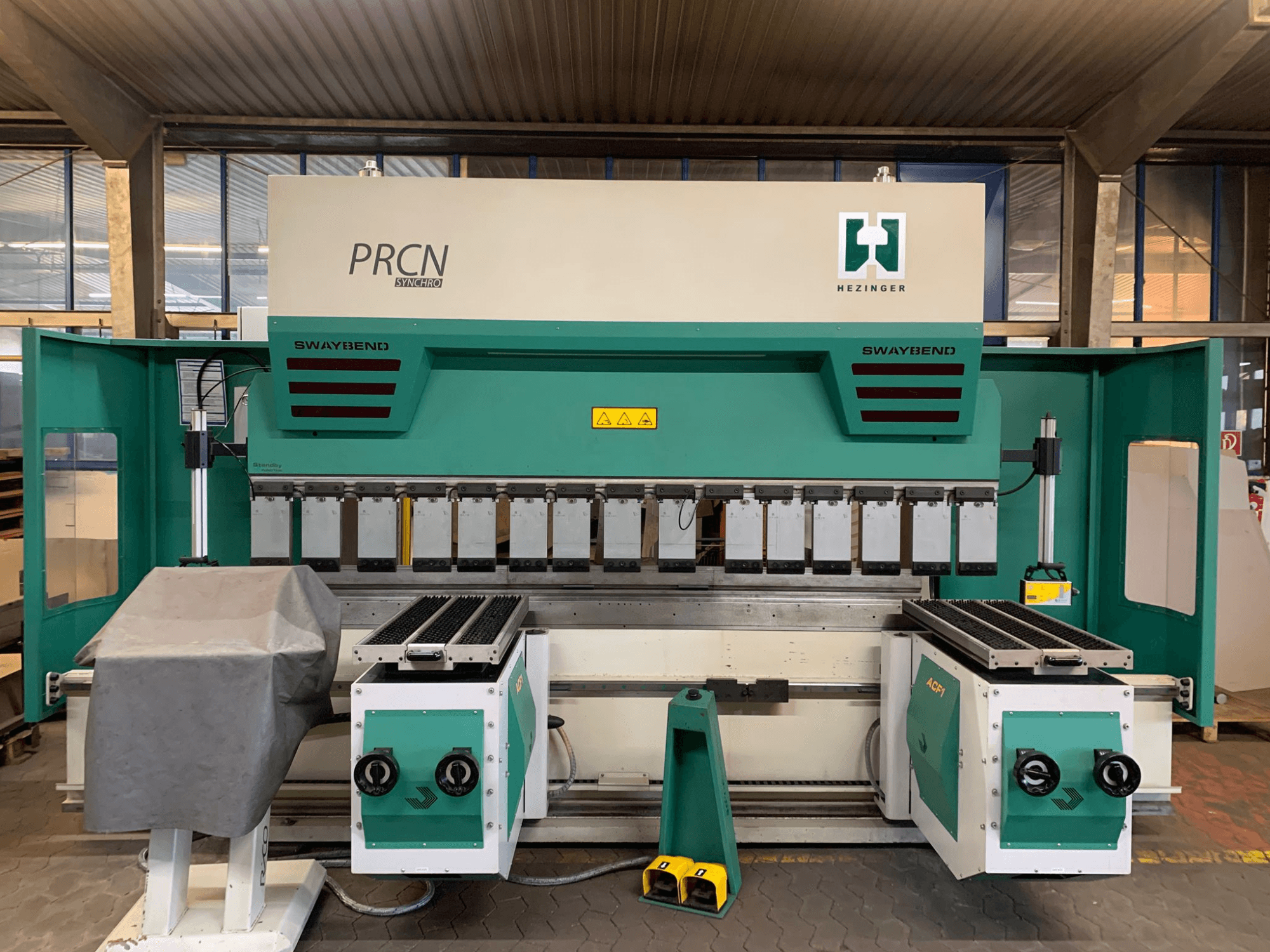 Press brake PRCN Synchro 30135, front view, with SwayBend and control panel visible, in a workshop setting.