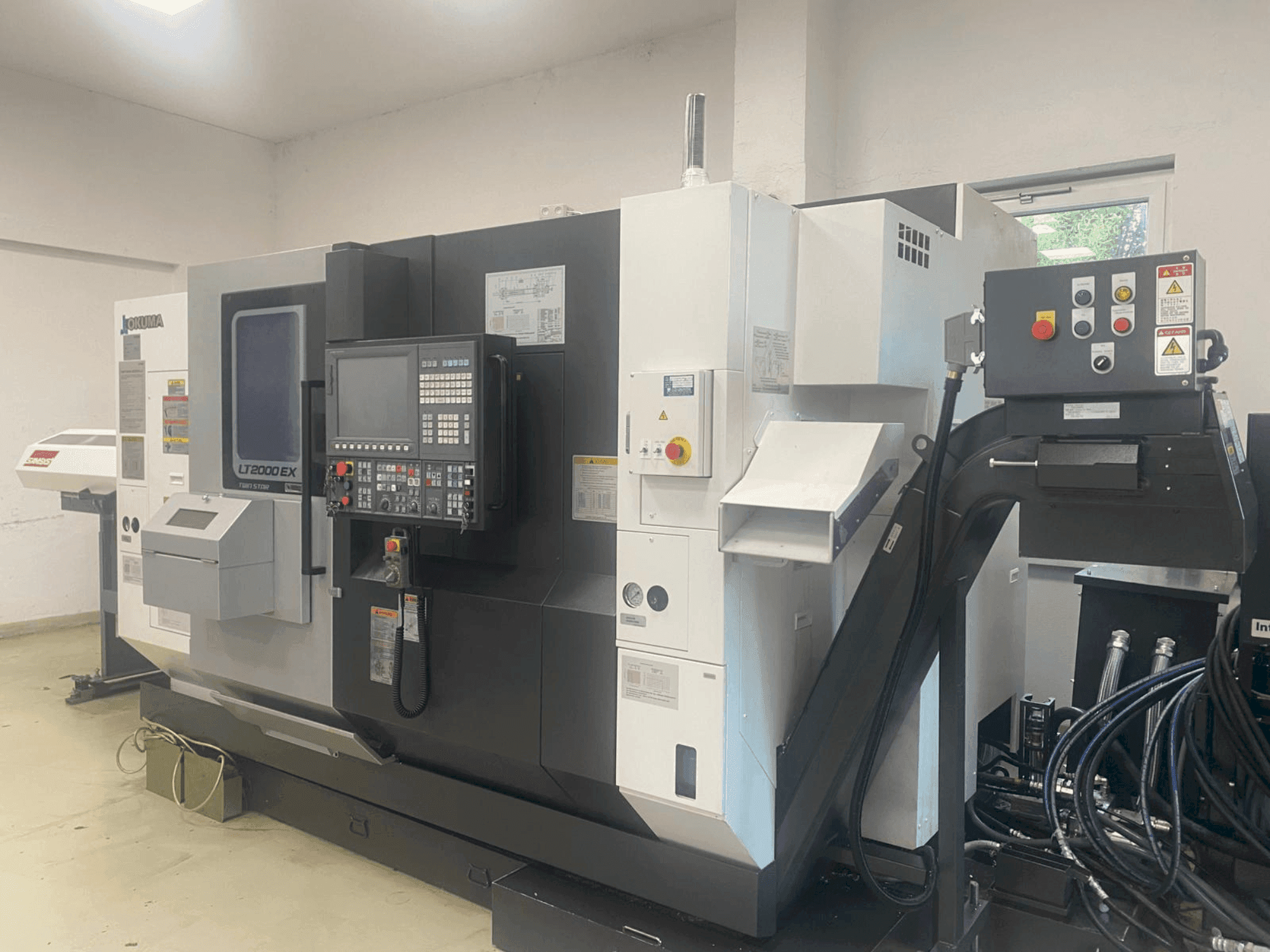 Front view of Okuma LT2000-2T1MY machine