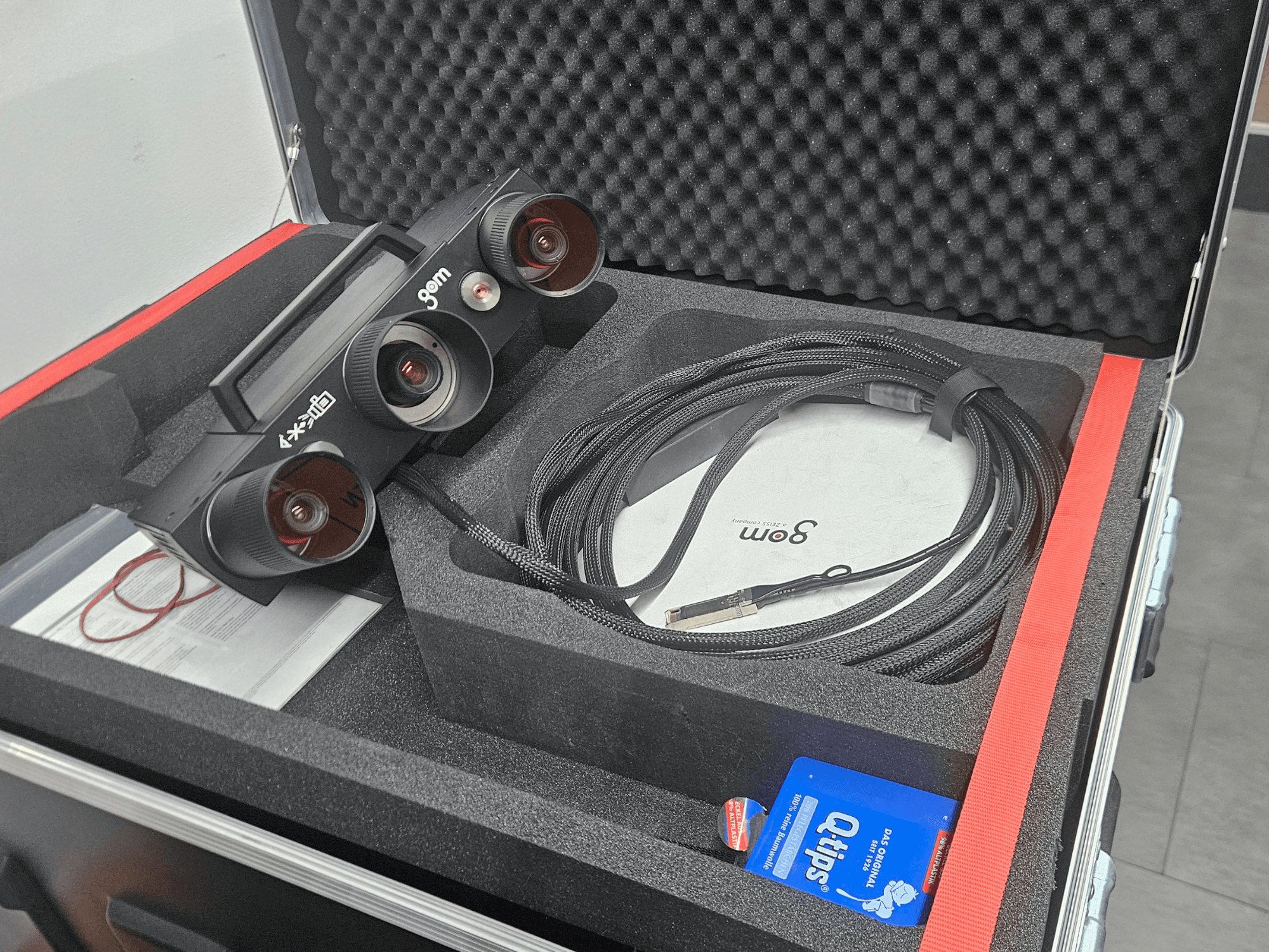 ZEISS GOM ATOS 5 optical measurement machine with lenses and cable, viewed from above in foam case.