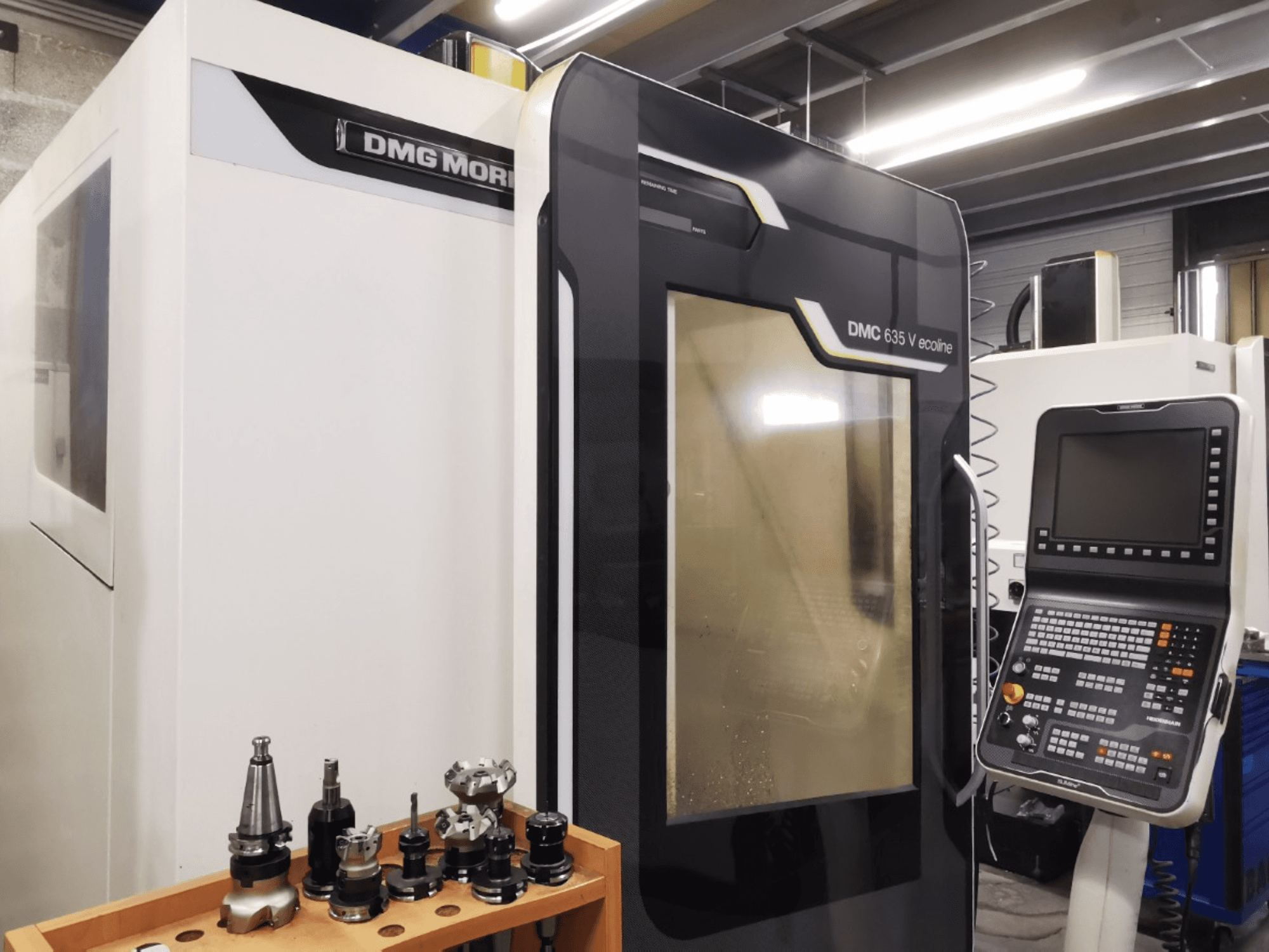 Front view of DMG MORI DMC 635 V ecoline vertical machining center, showcasing control panel and tool holder.