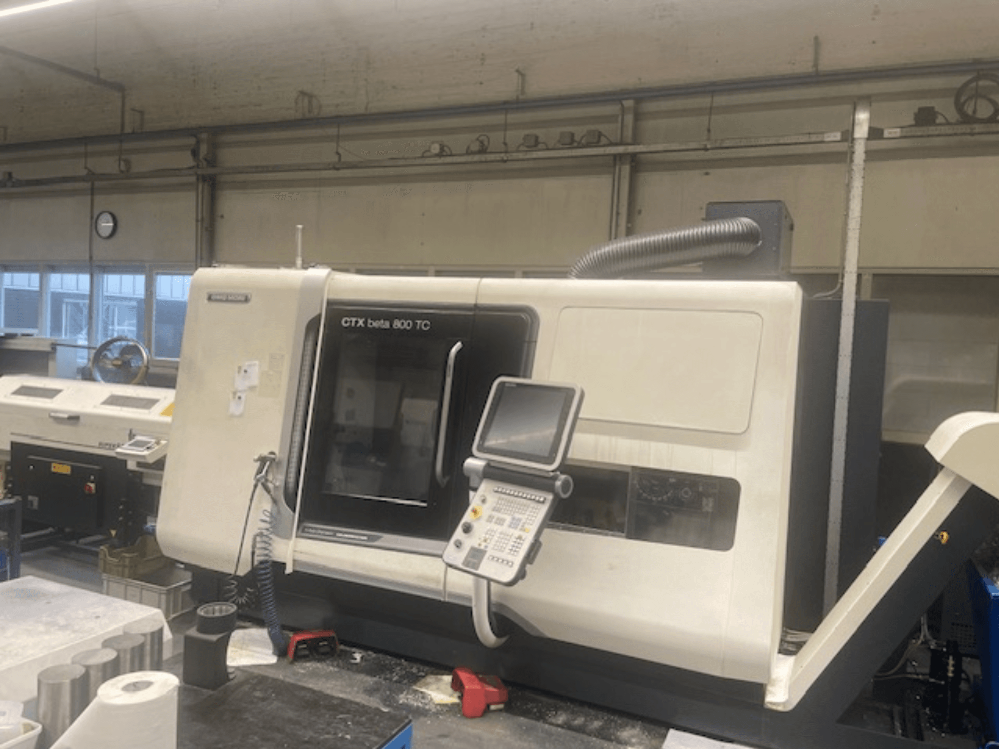 CTX beta 800 TC machine in a workshop; front view showcasing control panel and dust extraction system.