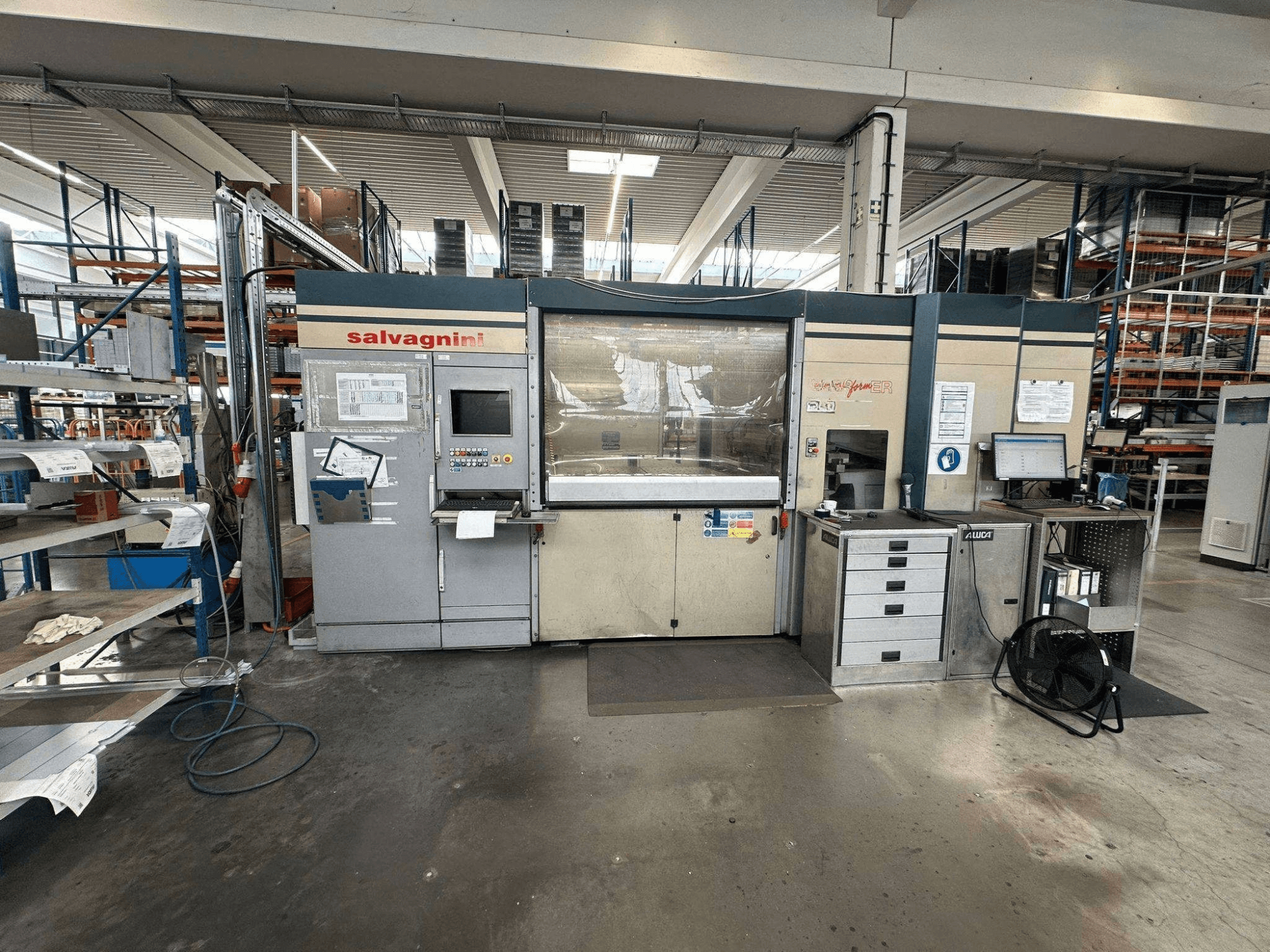 Salvagnini Performer P2 press brake in a factory setting, front view, showcasing control panel and workstations.
