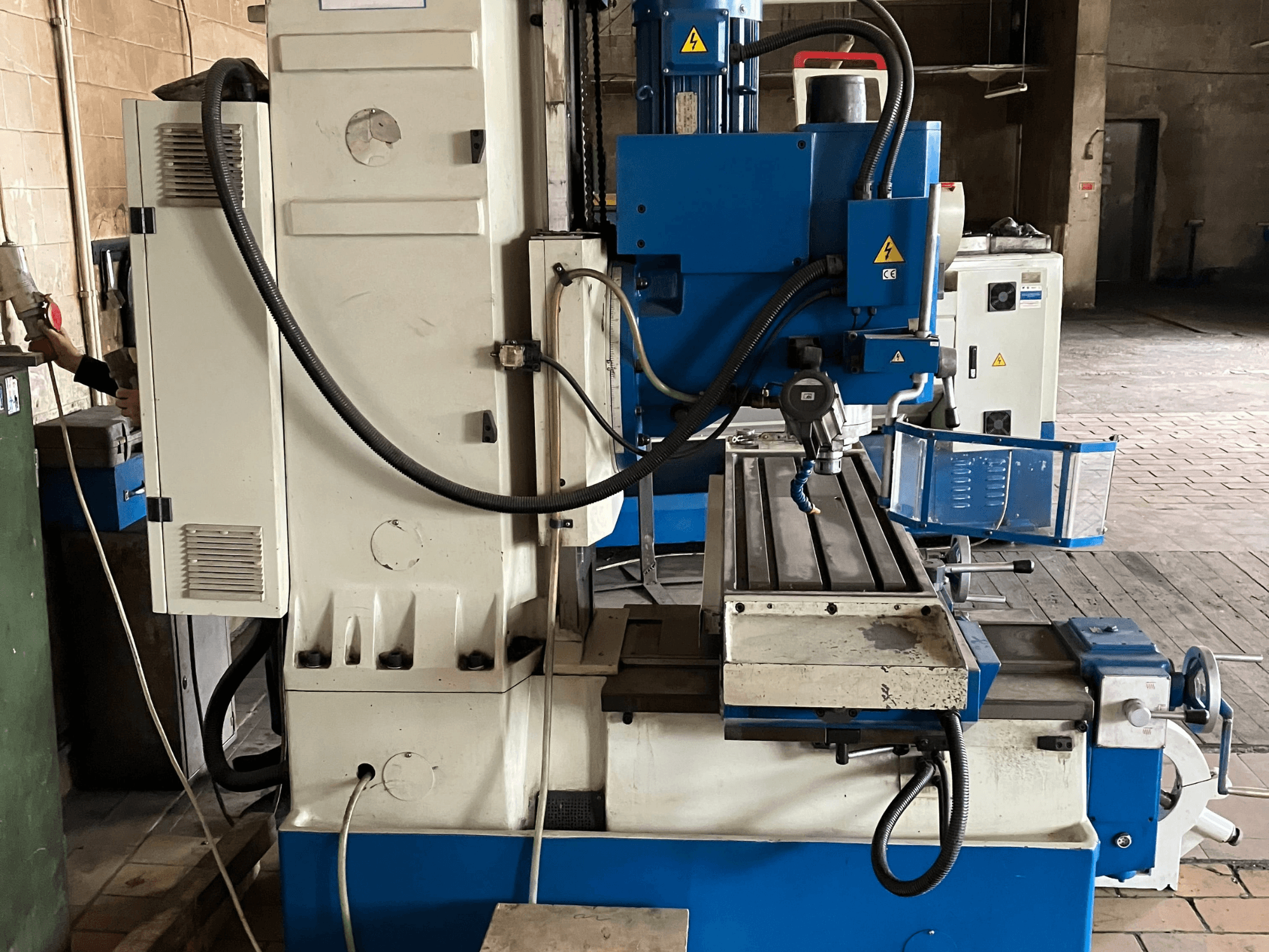 Vertical Machining Centre KNUTH KB 1400, front view showing control panel, cutting tool, and working table with linear rails.