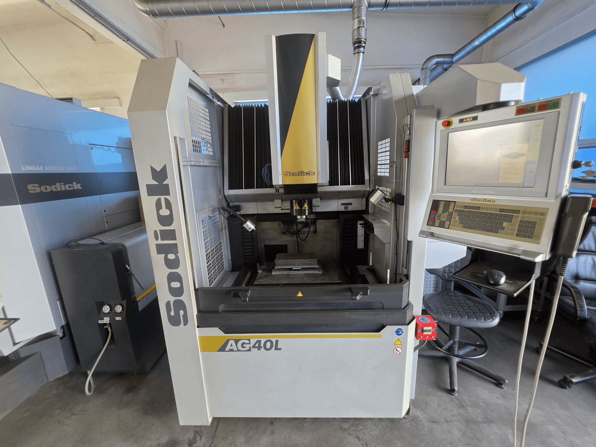 Sodick AG40L LN2 Die-Sinking EDM Machine, front view with control panel, linear motor drive, and workpiece holder visible.