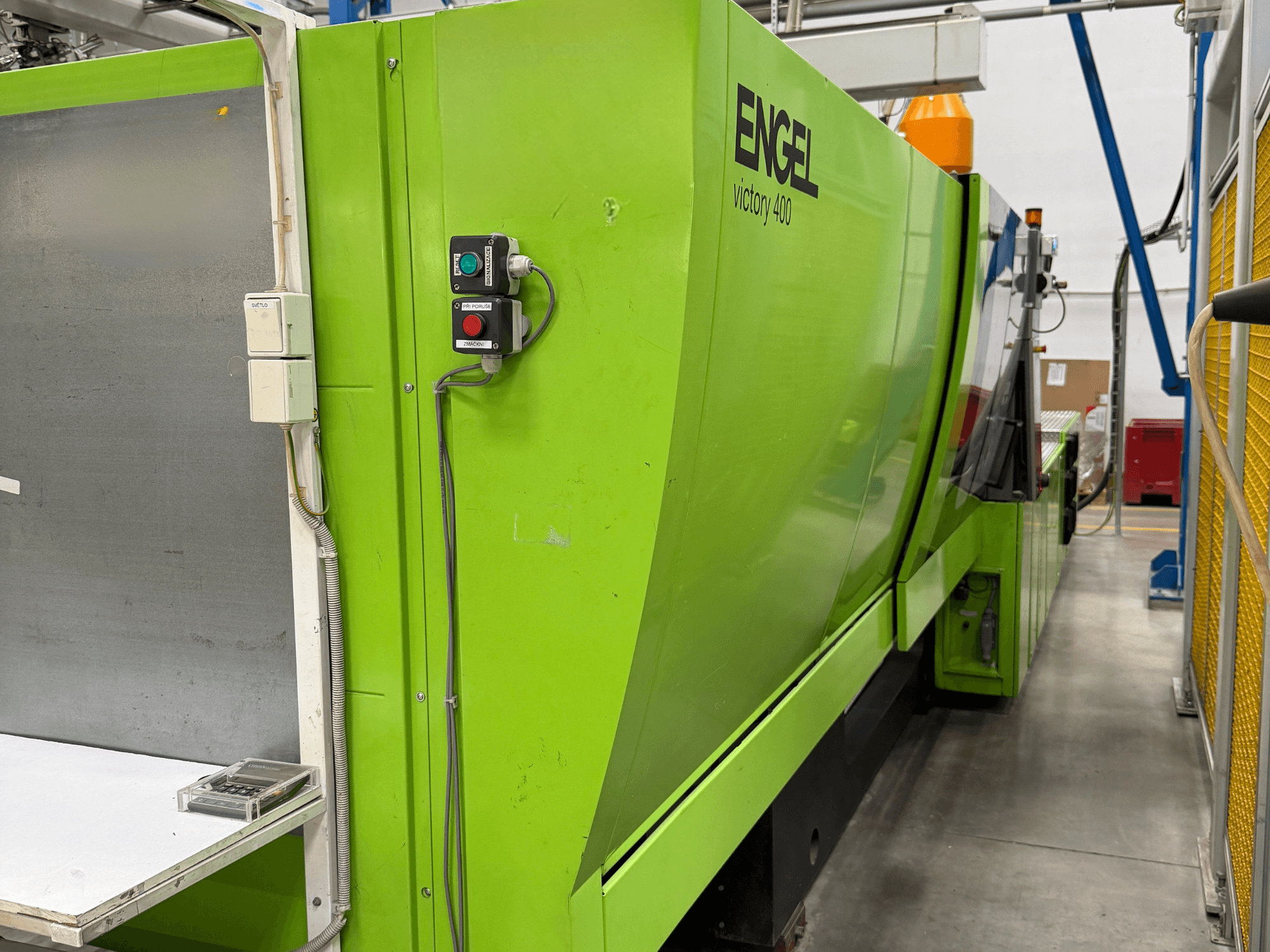 Engel Victory 400 hydraulic injection moulding machine, side view, with control panel and green exterior.