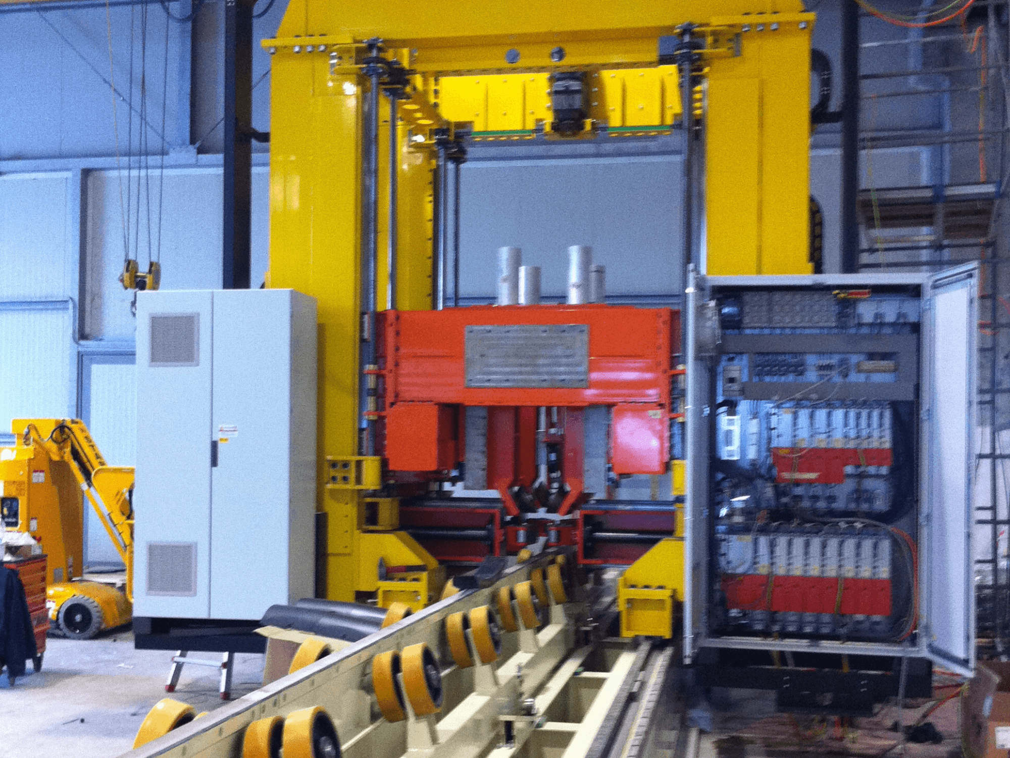 RONDA IMPIANTO CHIUSURA E SALDATURA LASER machine, front view showing control panel and welding components, industrial setting.