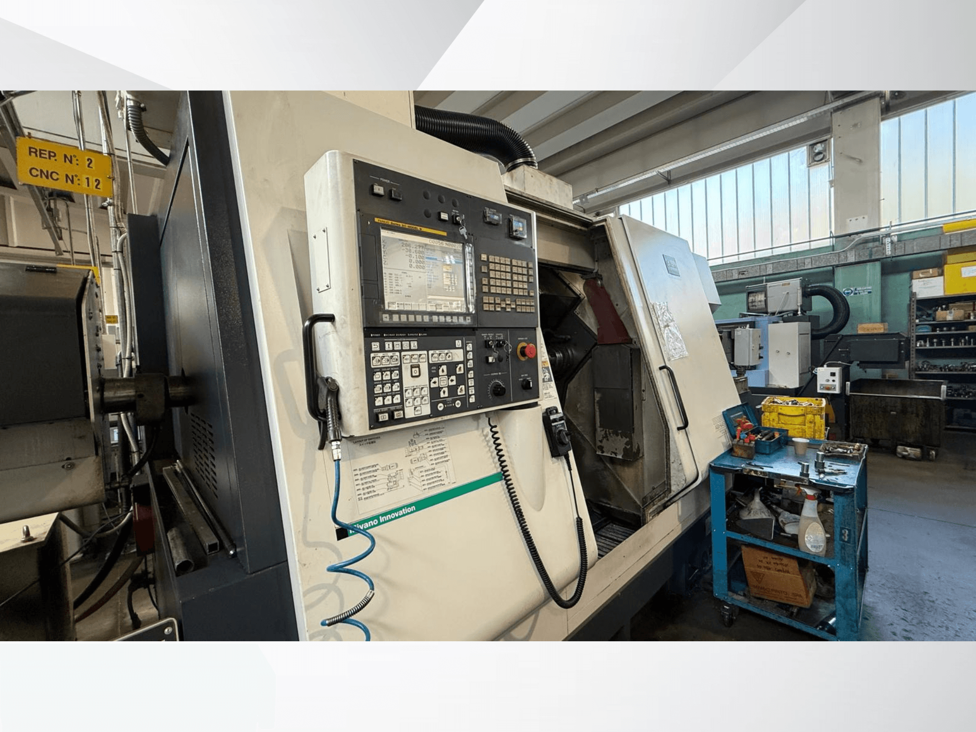 Miyano ABX64 YY2 horizontal turning machine front view, featuring control panel, with tools and equipment in workshop setting.