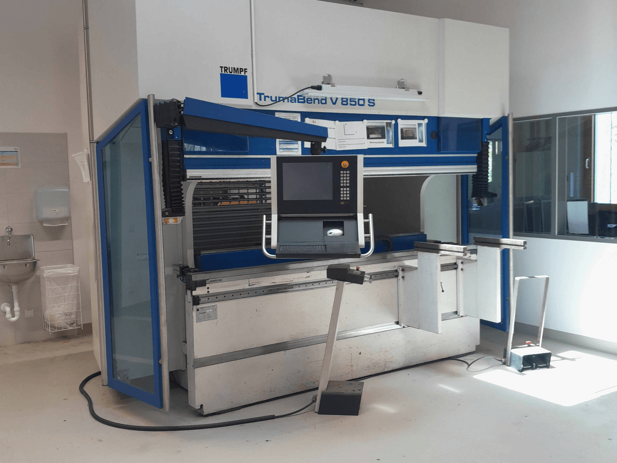 TRUMPF TrumaBend V 850 S press brake, front view with control panel and safety features in a bright workspace.
